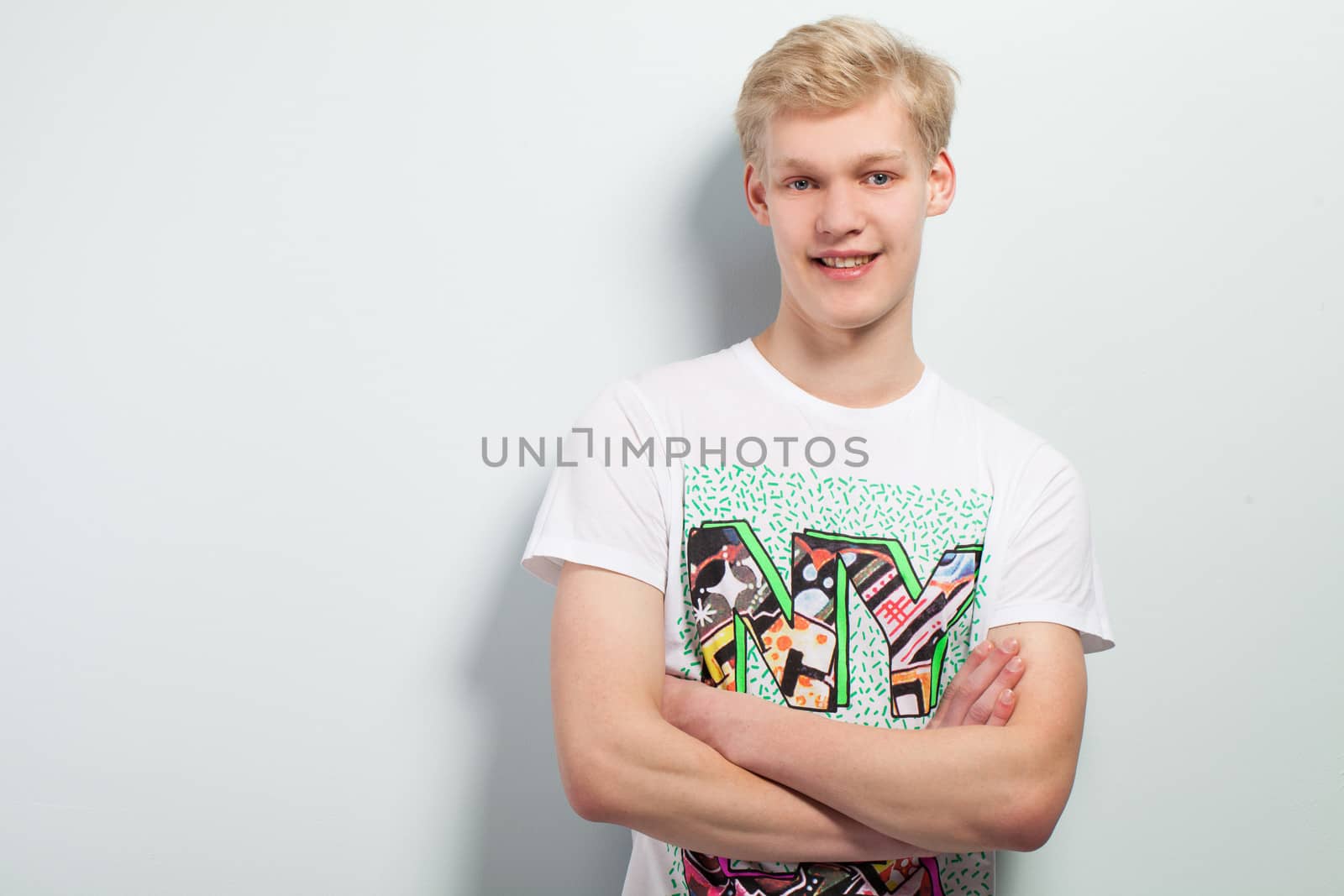 Young blond caucasian man in casual over background