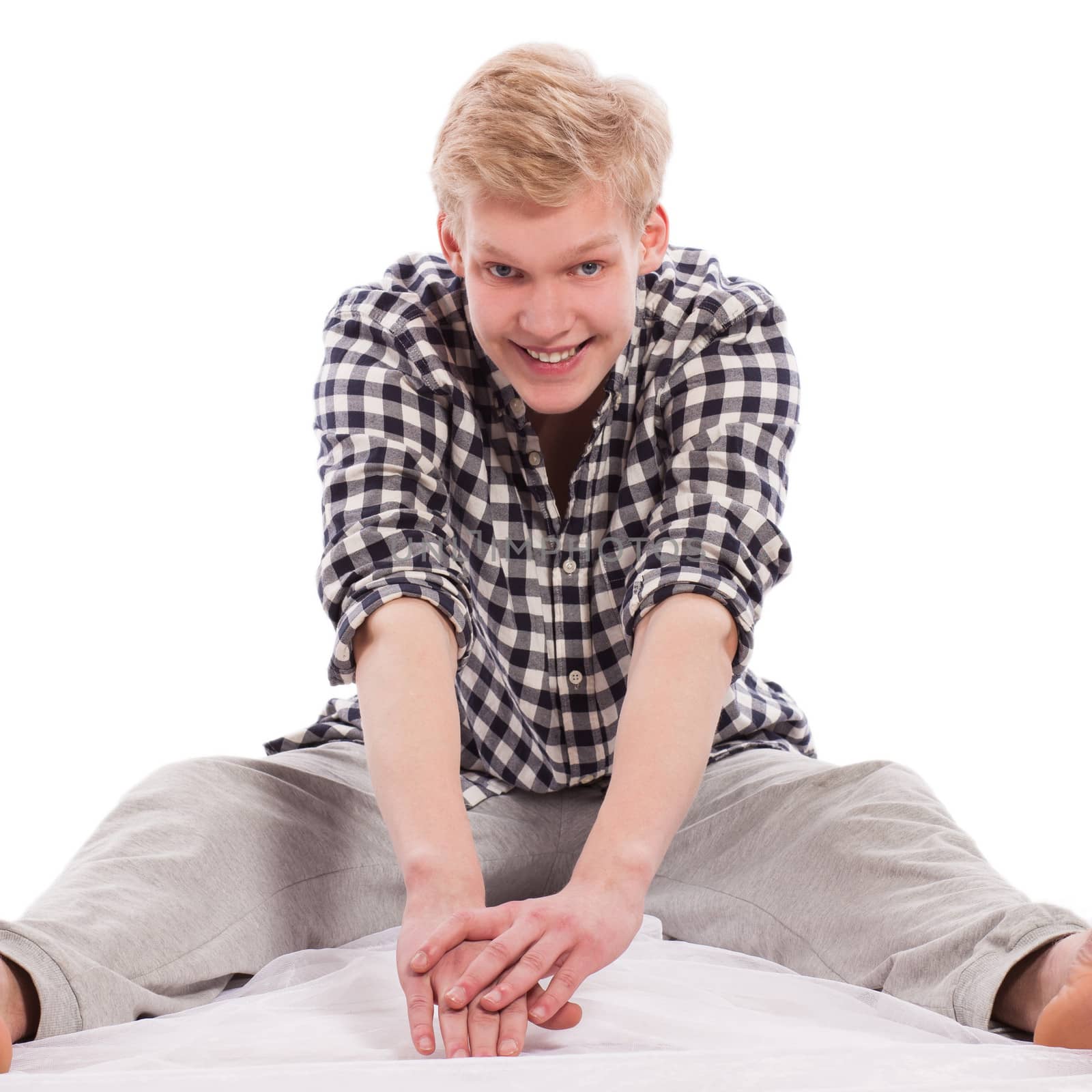 Young caucasian man working out on a white background