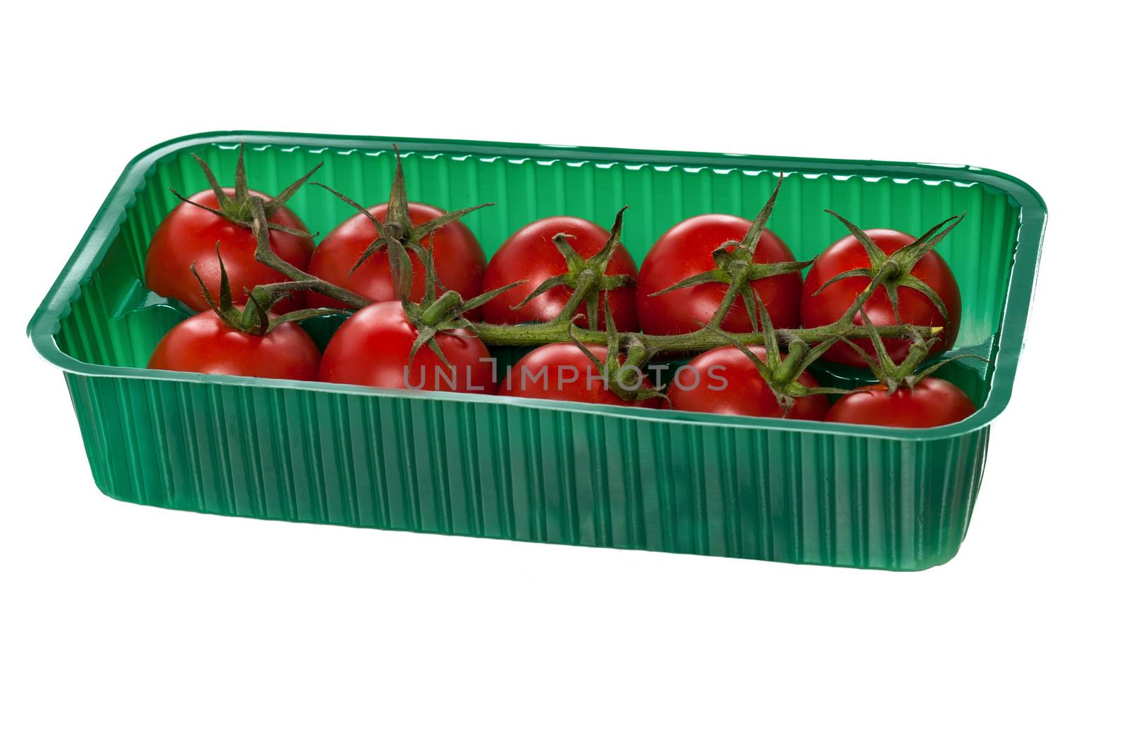 Cherry tomatoes in retail packaging against white