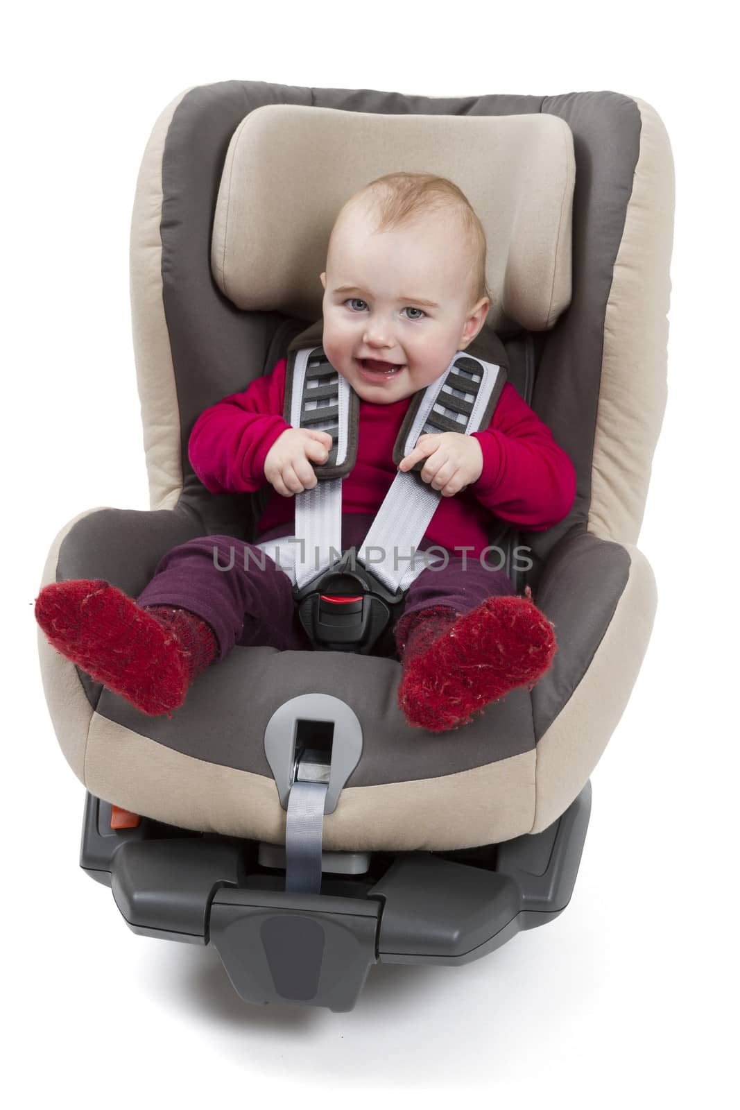 booster seat for a car in light background. studio shot with kid