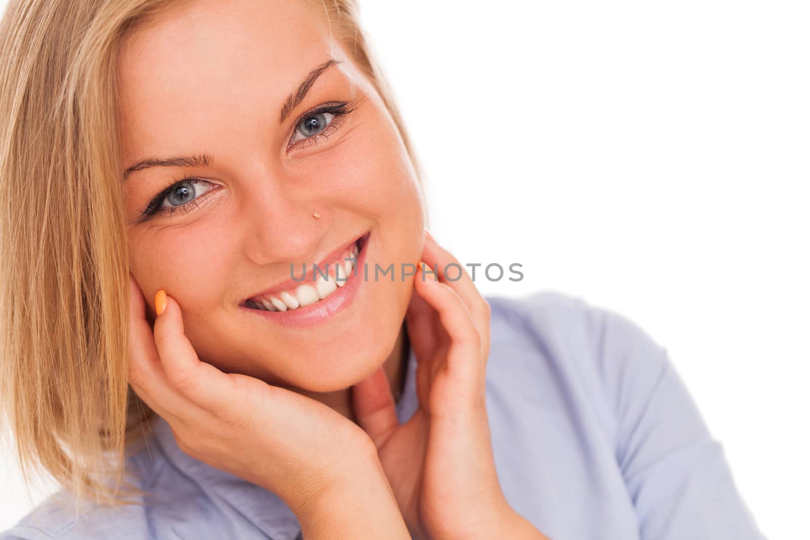 Closeup portrait of young blond caucasian woman smiling over white background