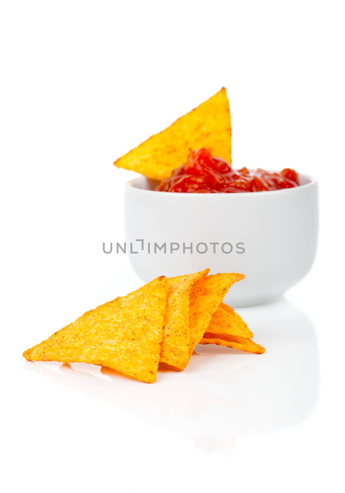 Nachos corn chips with fresh salsa isolated on white by motorolka