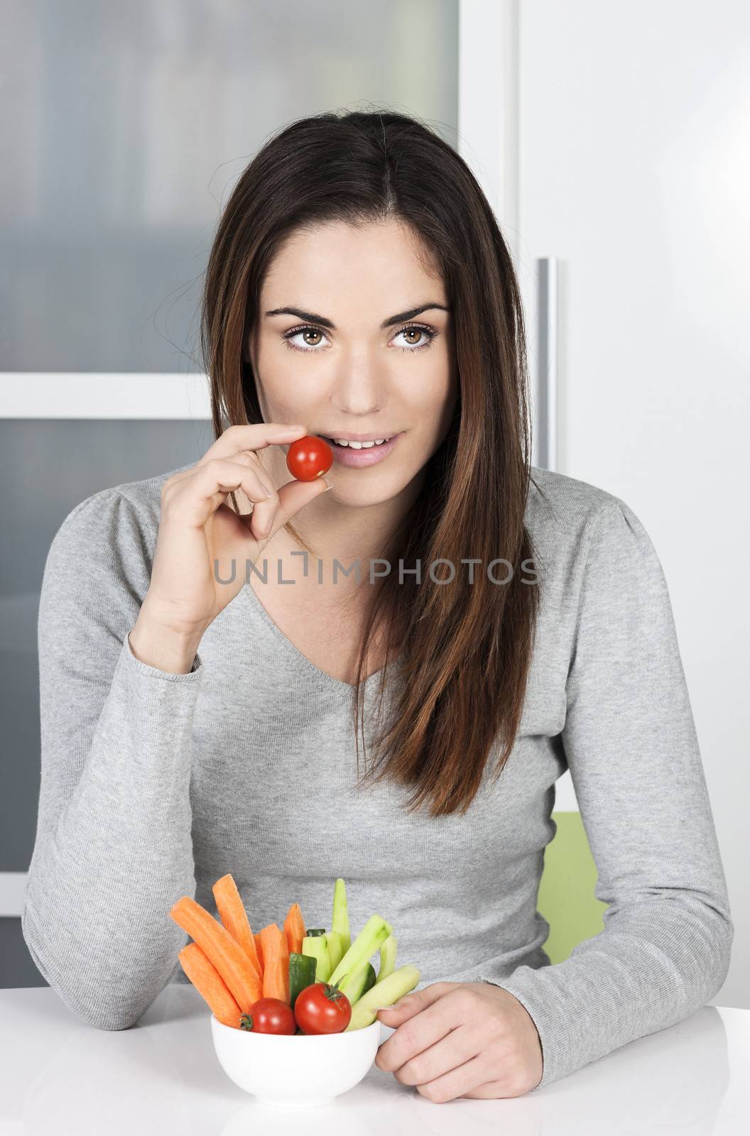 Cute girl eating healthy food at home