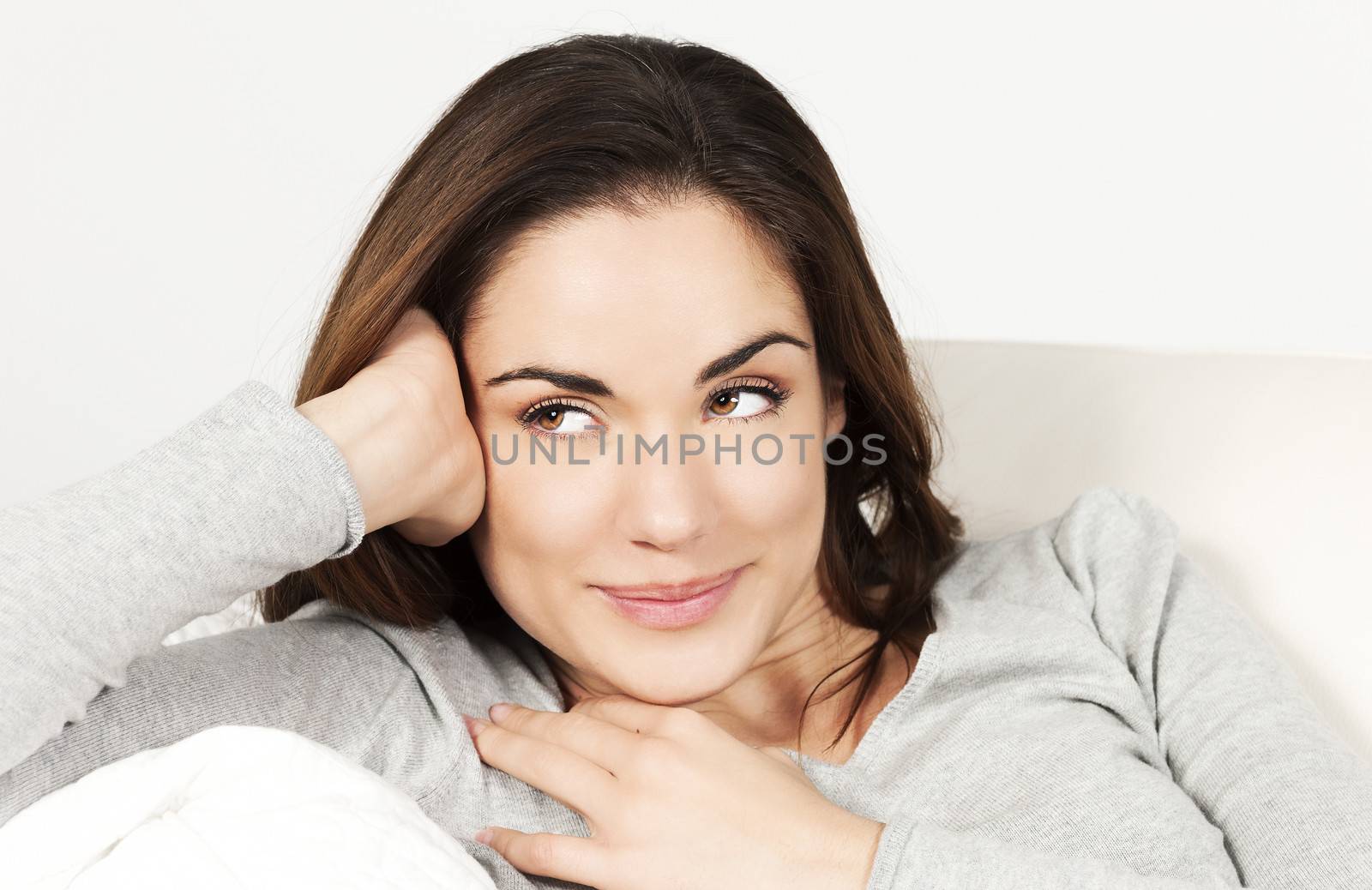 Portrait of cute woman on the sofa at home