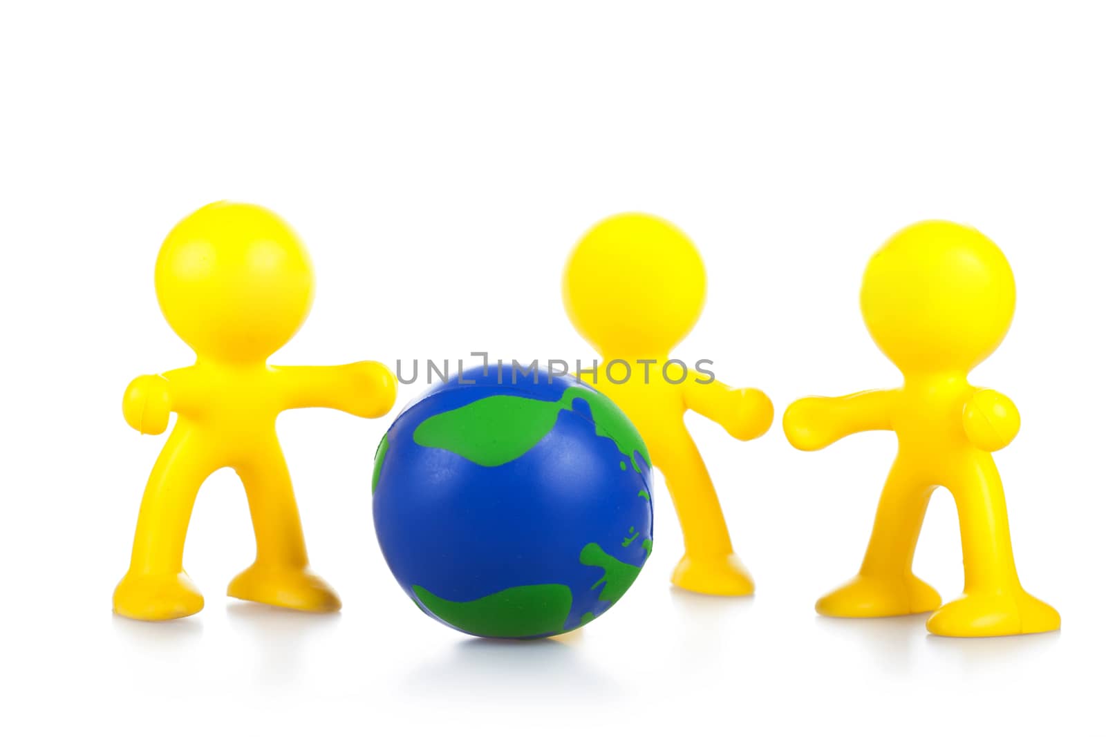  toy little men hold globe. It is isolated, a white background