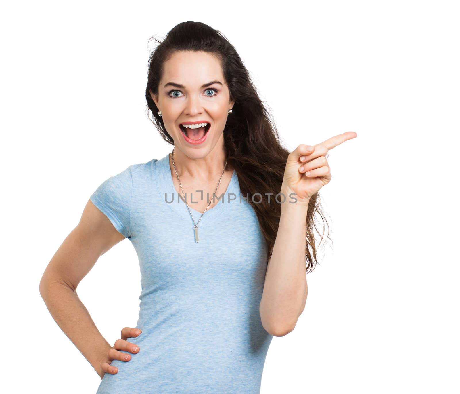 A beautiful happy woman pointing at copy-space. Isolated on white.