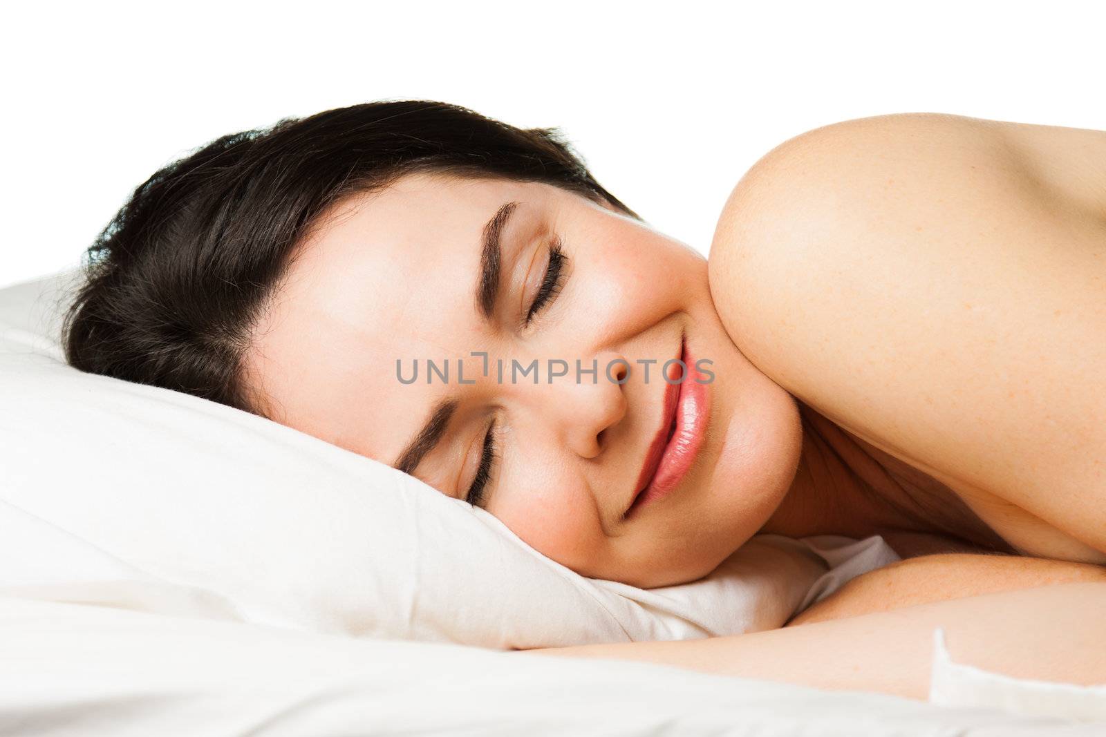 Portrait of a beautiful young woman sleeping peacefully. Isolated over white.