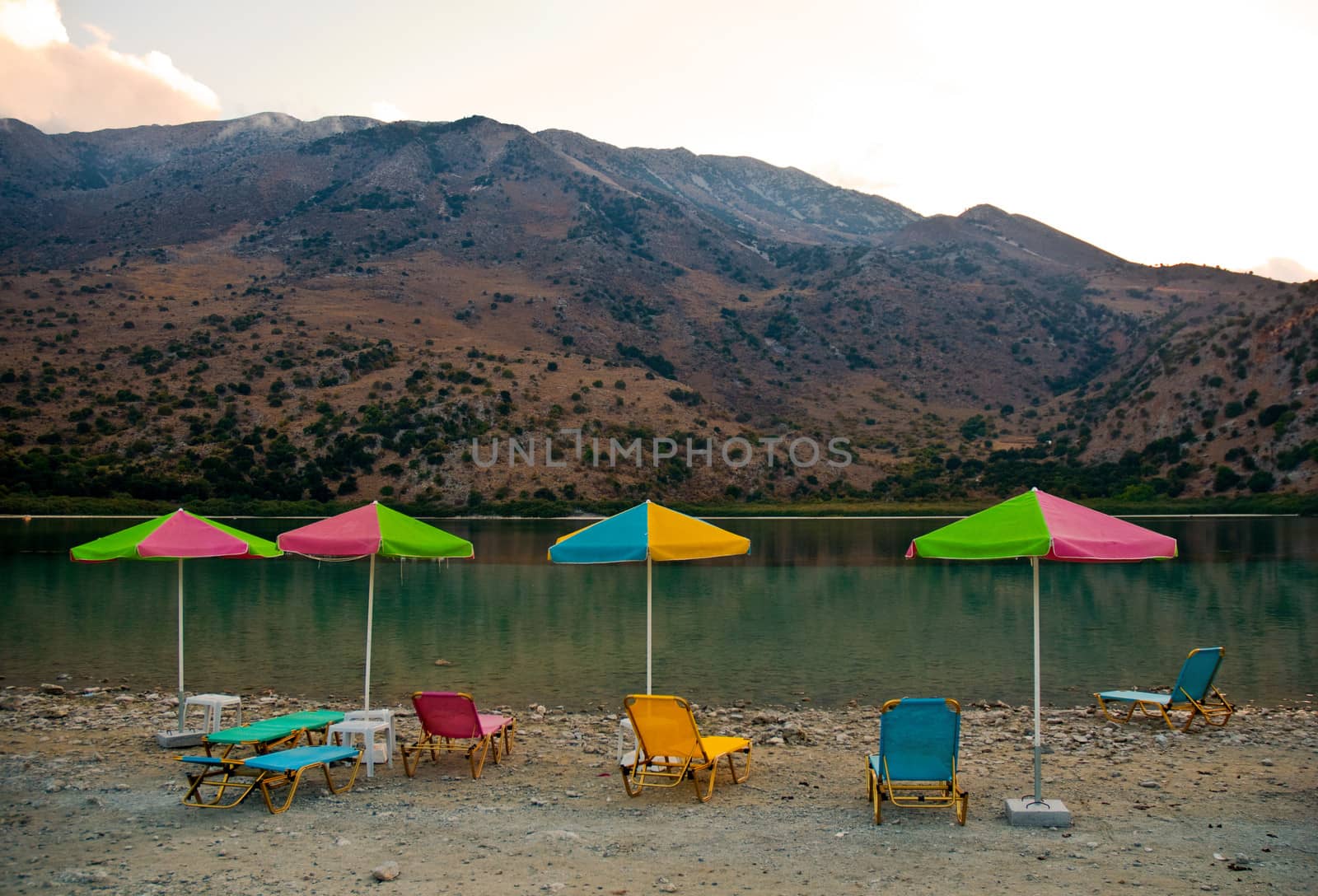 Sunbeds on a shore of Kournas lake. Crete, Greece .