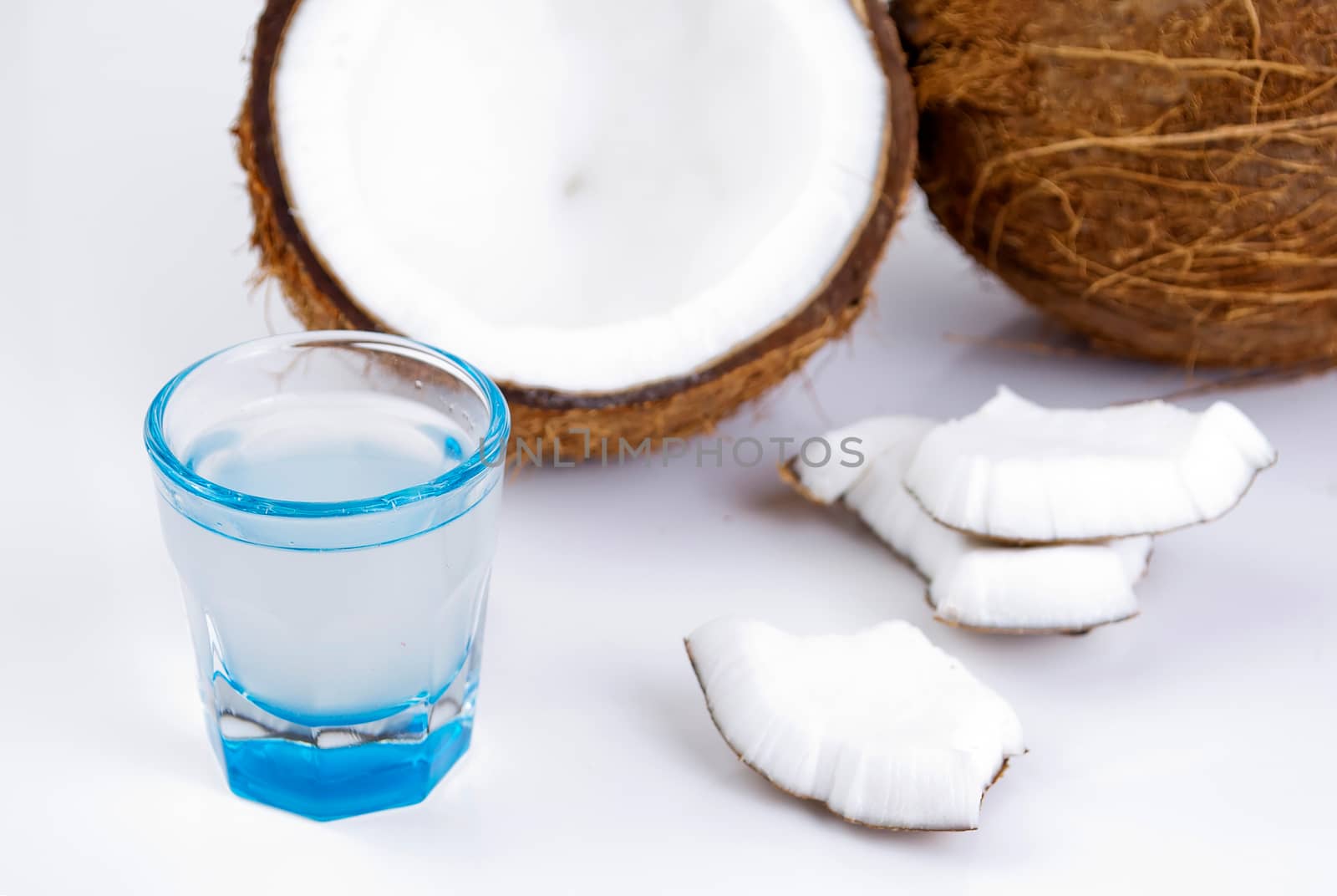 freshly cut coconut and milk isolated on white background