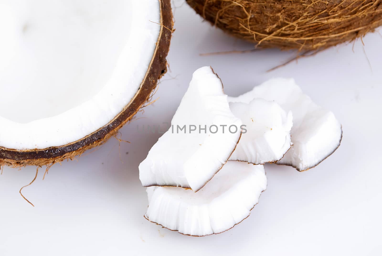 freshly cut coconut and milk isolated on white background