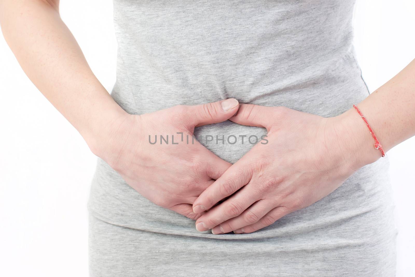 young woman with stomach pain making massage to relief ache