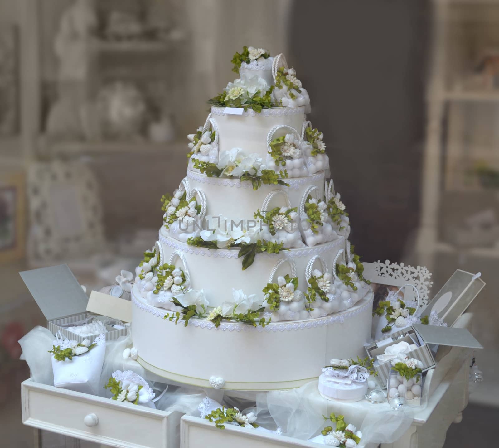 Gorgeous white and green multi tiered wedding cake
