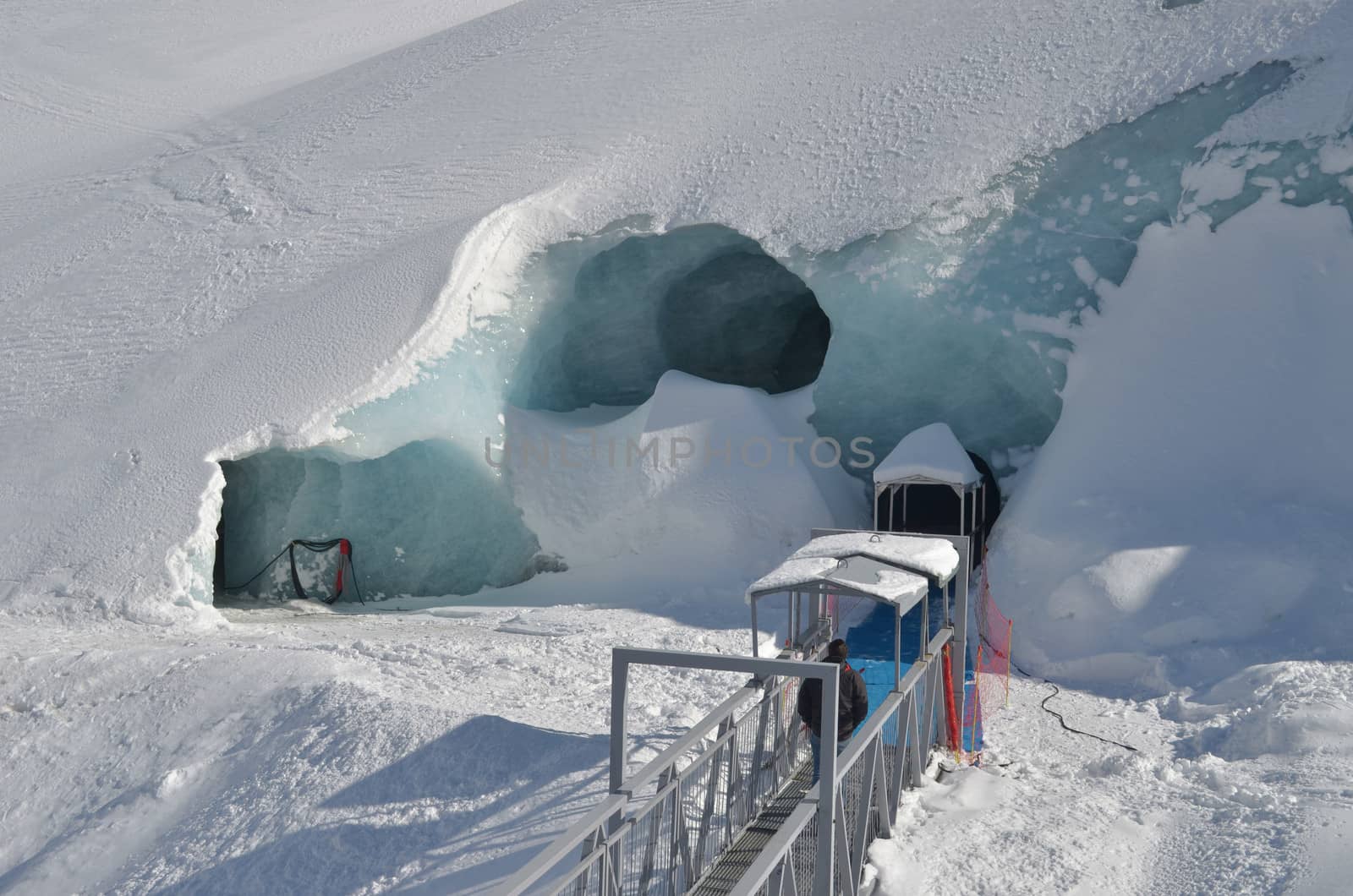 Entrance to ice cave under glacier in Chamonix by artofphoto