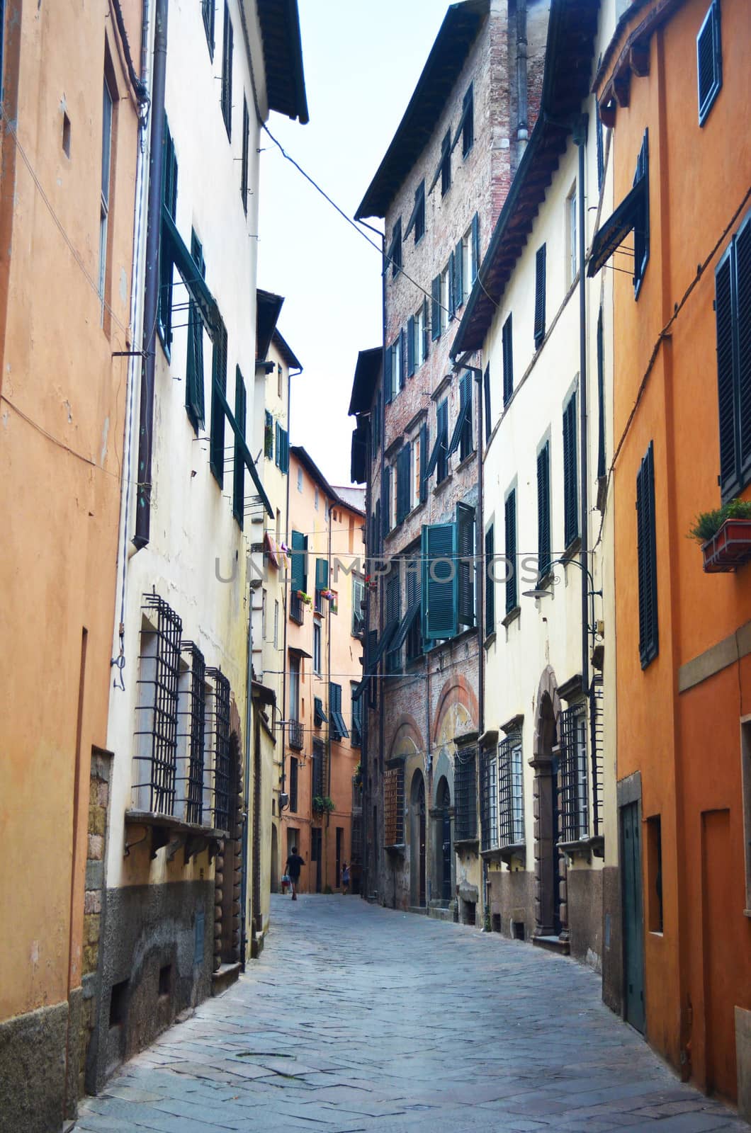 Narrow and old street or alley in italian town. Historical view of Italy