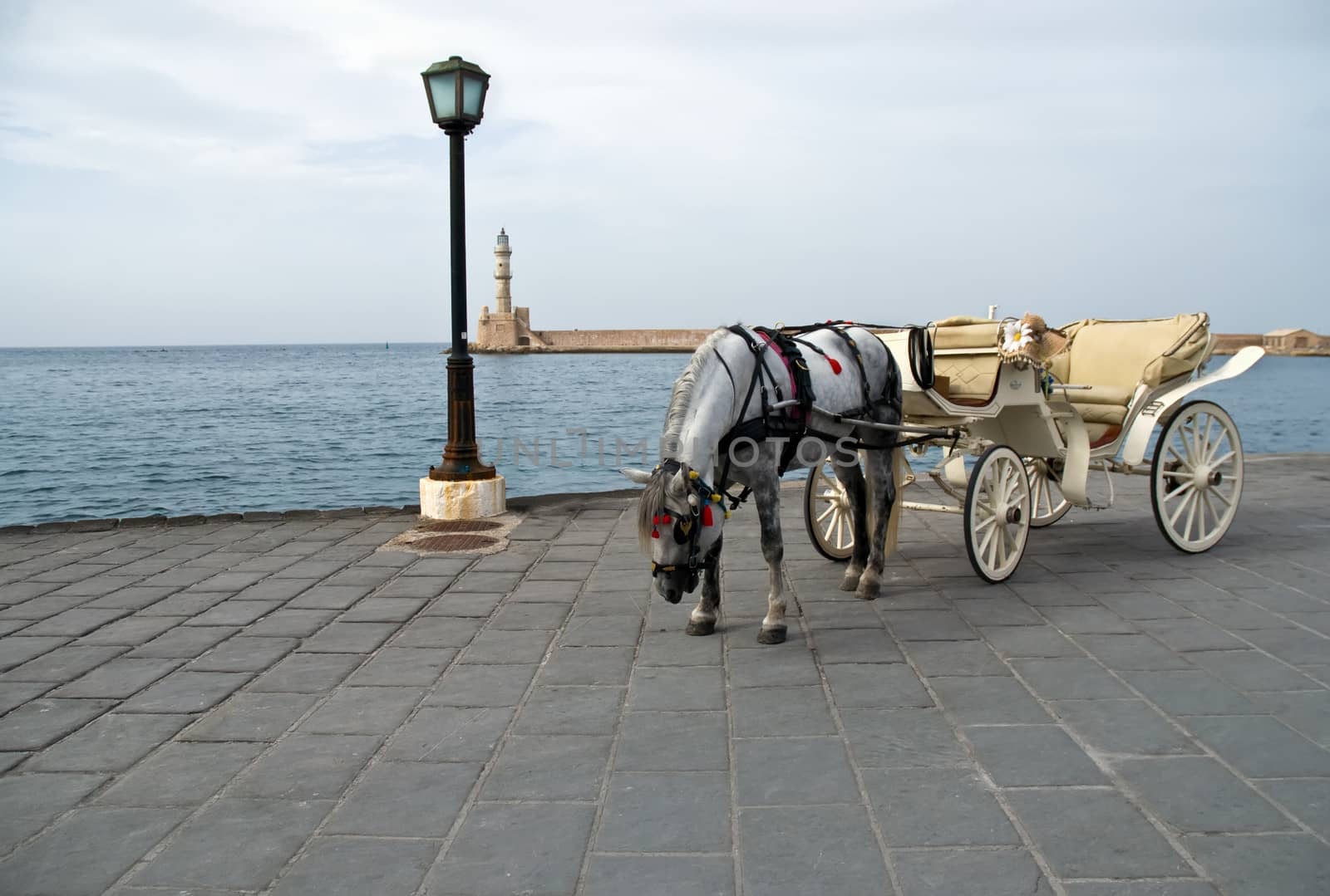 Coach before chania lighthouse . by LarisaP