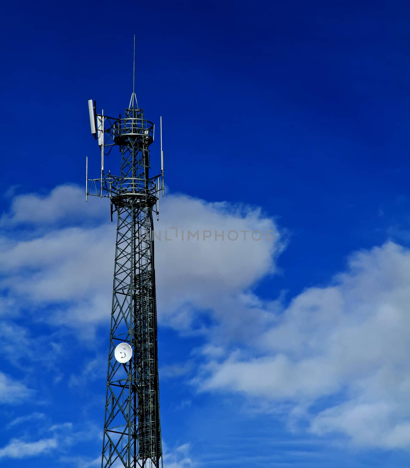 Communication tower over a blue sky background