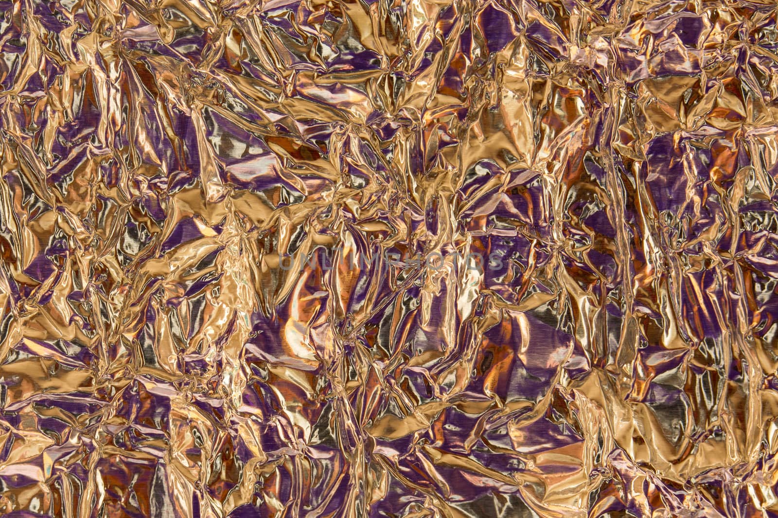 Crumpled Purple and Gold Tin Foil Texture Background