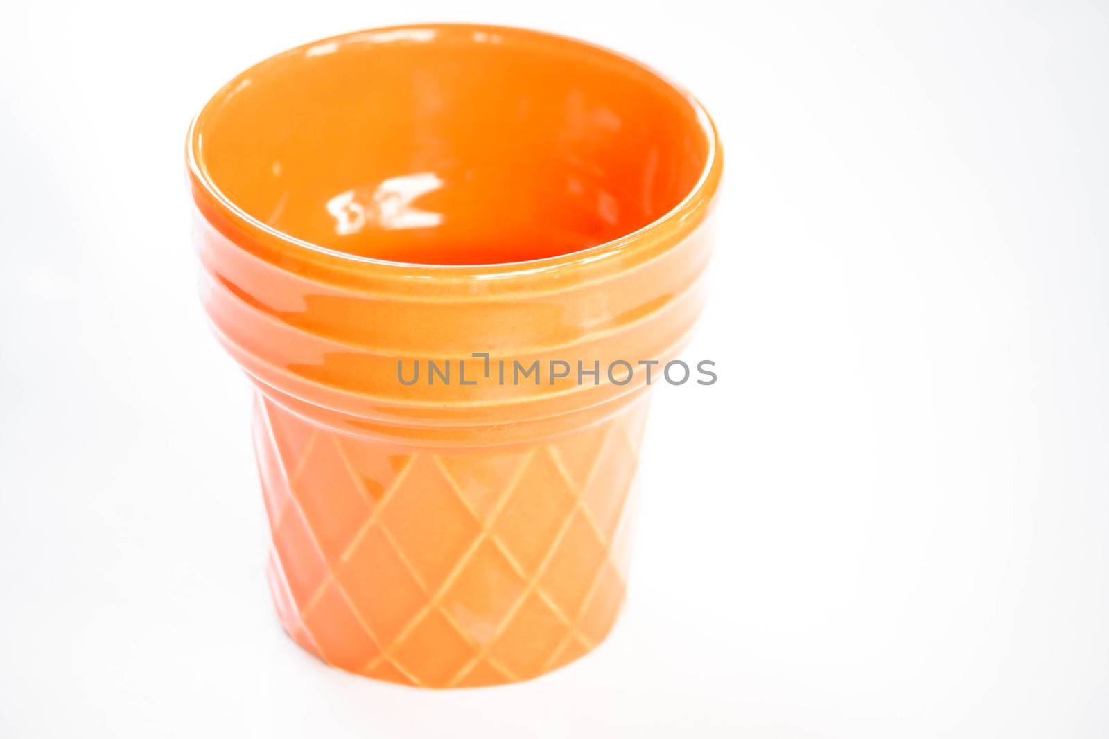 Orange ceramic plant pot isolated on white background