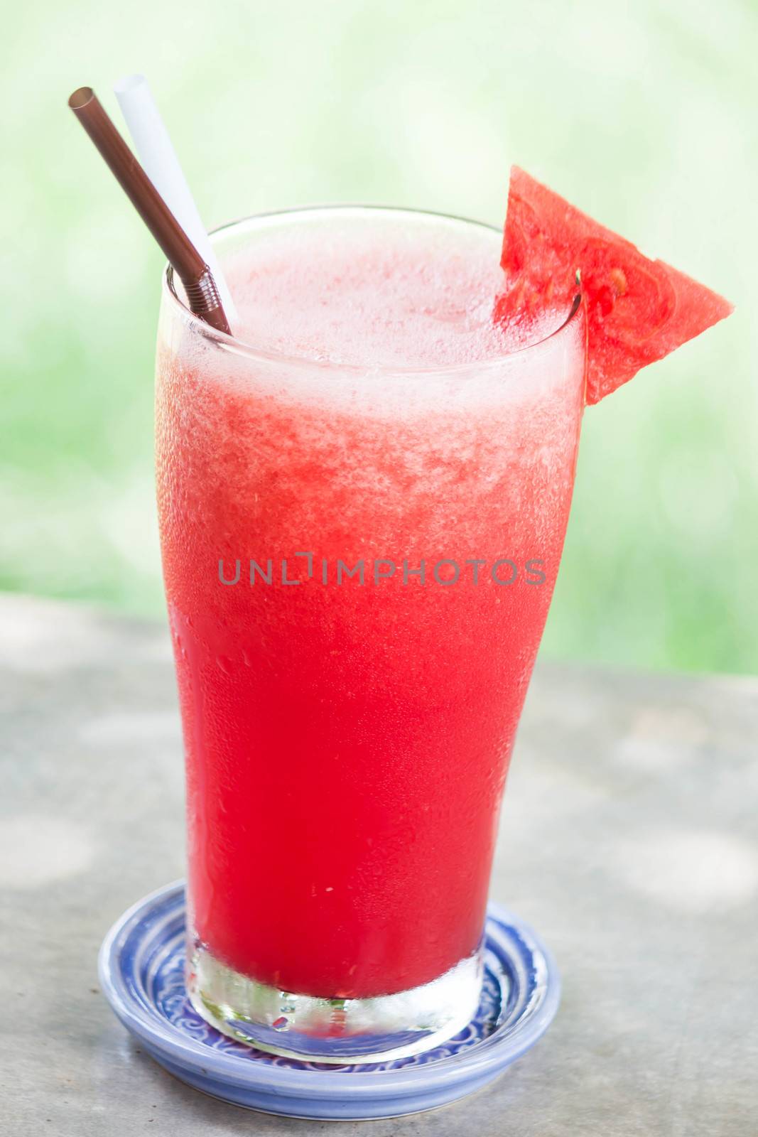 Red water melon fruit juice frappe with melon piece  by punsayaporn