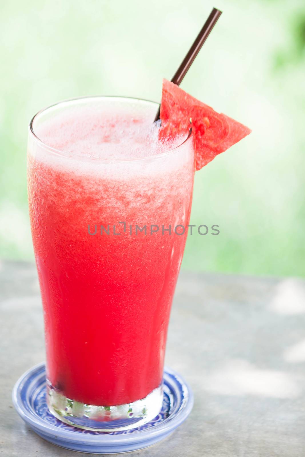 Red water melon fruit juice frappe on gray counter