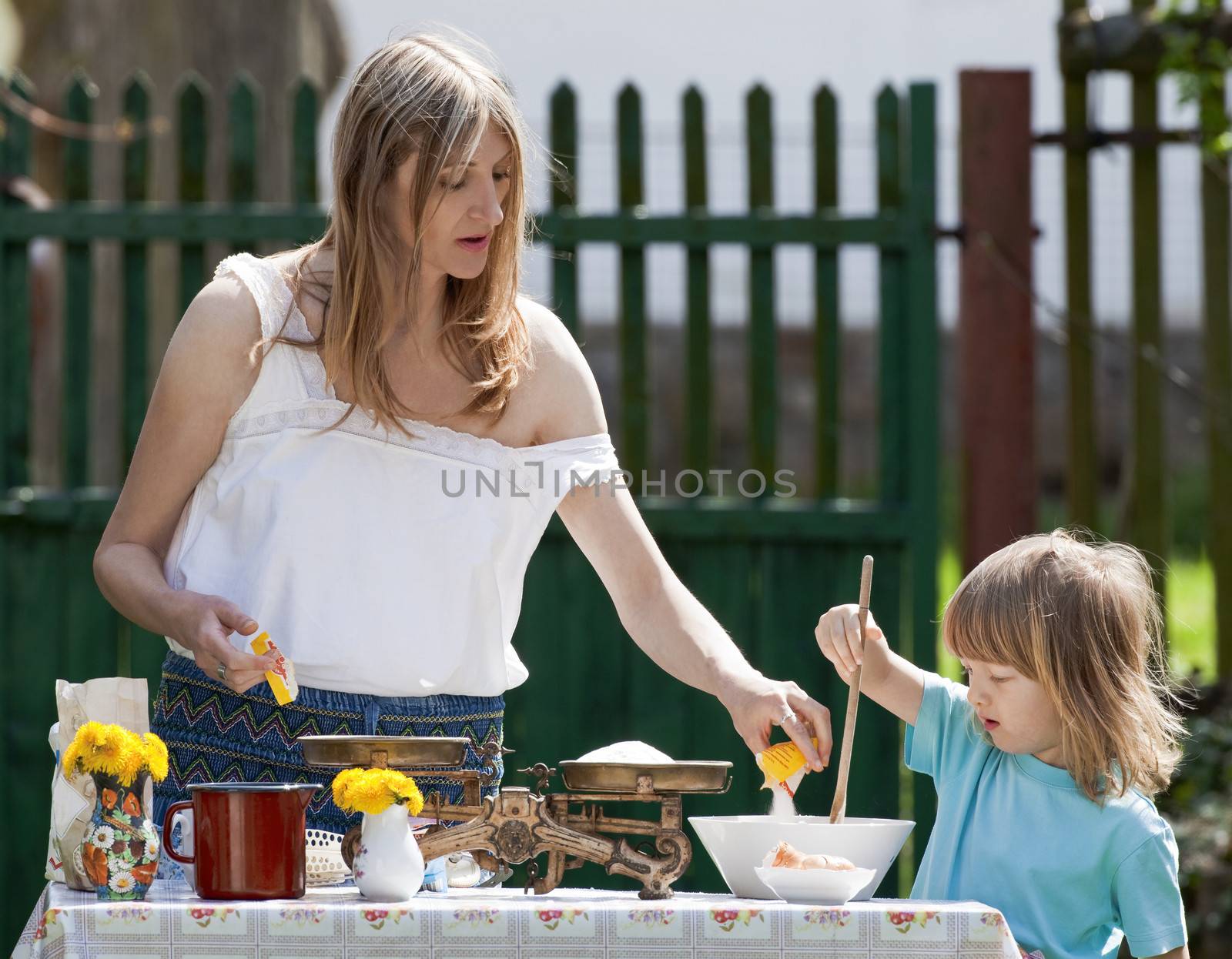 mother and son baking in the garden