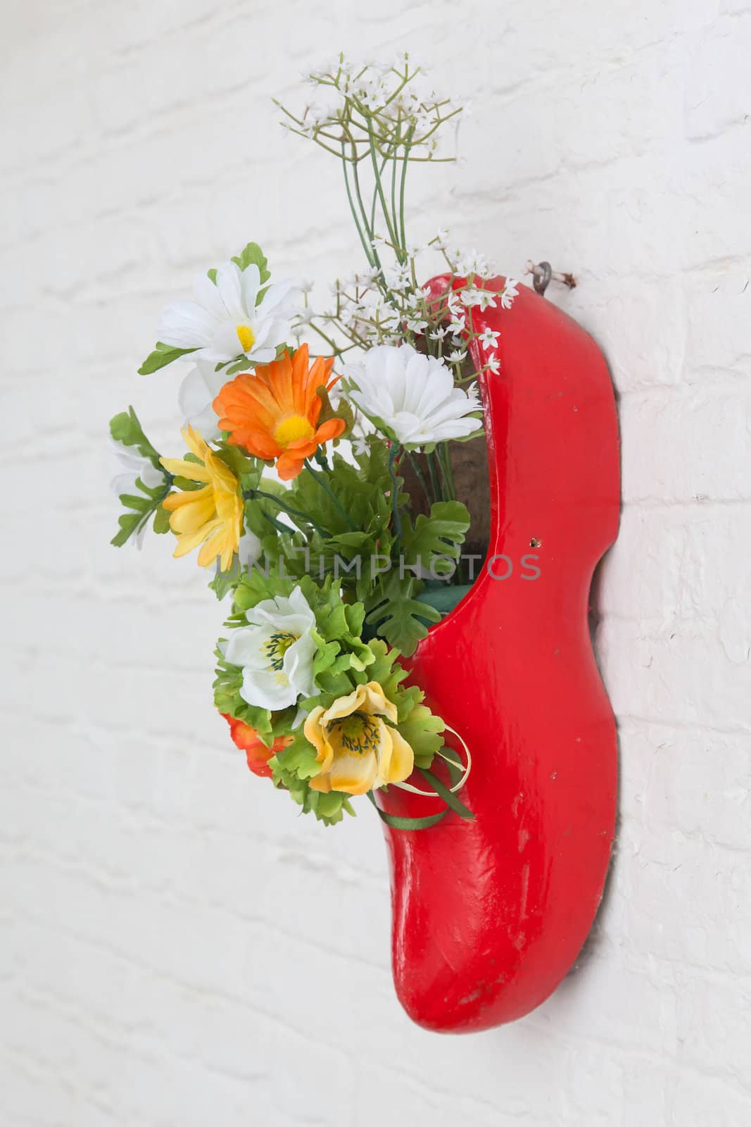 Dutch wooden shoe with fake flowers by michaklootwijk