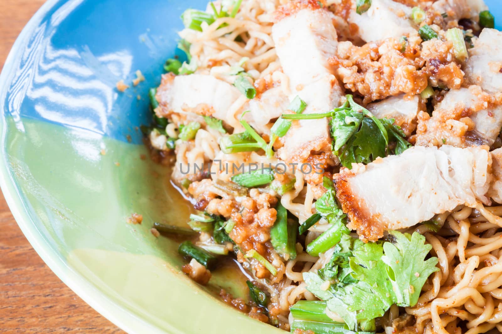 Spicy stir fried noodles with crispy pork