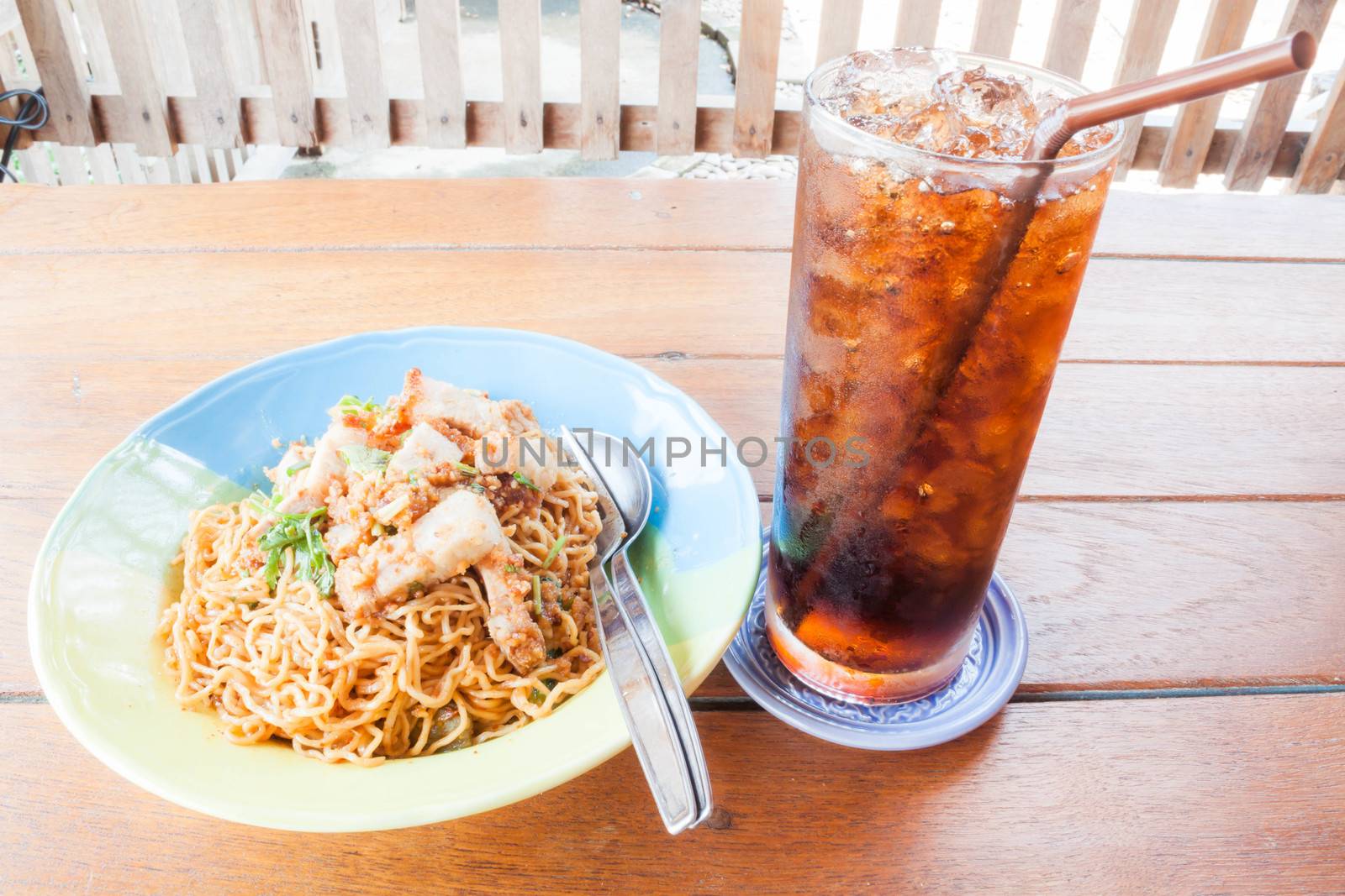 Easy meal with stir fried spicy noodles and cola