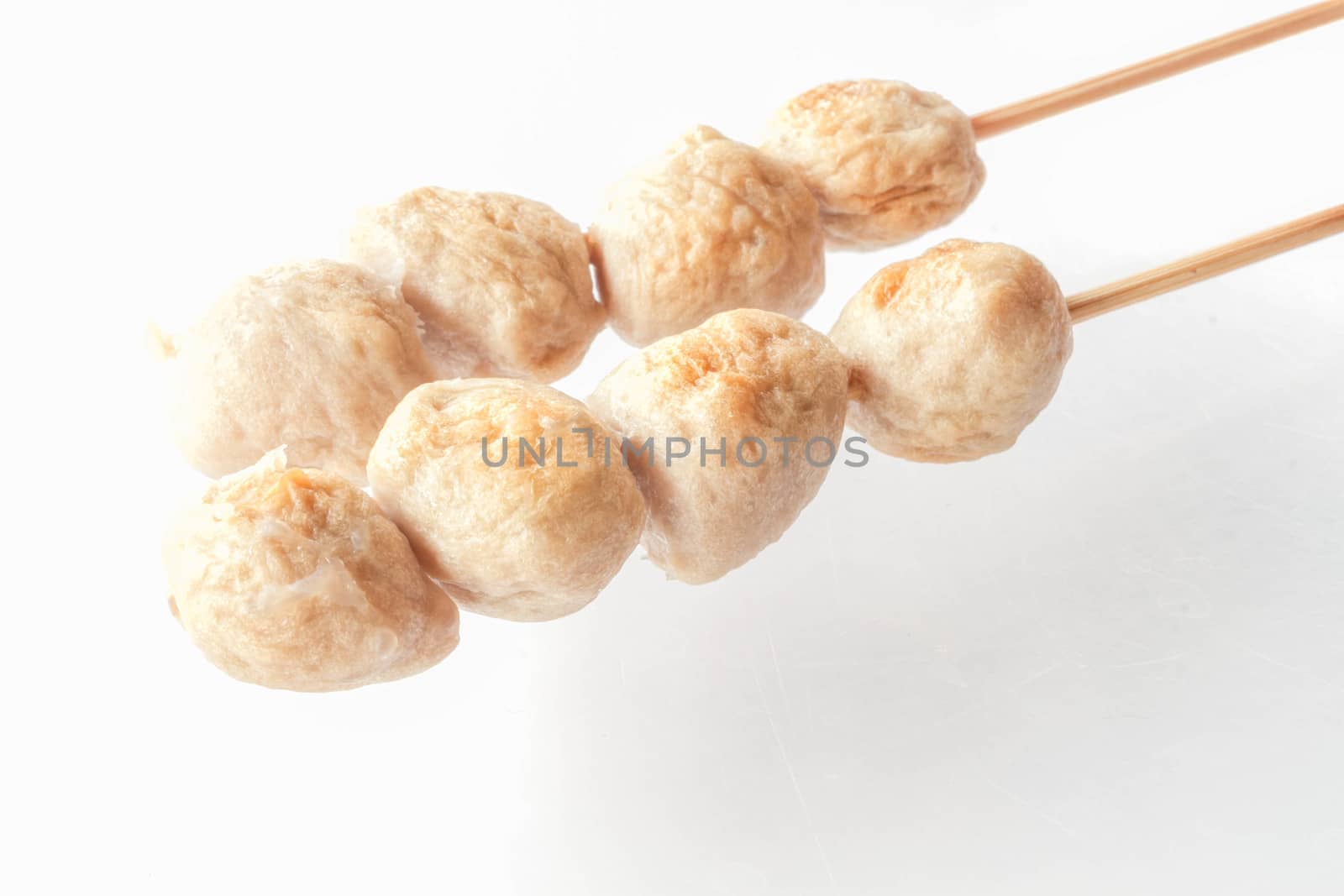 Mini pork balls in wood stick on clean table