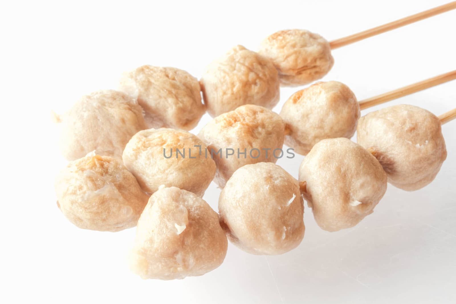 Mini pork balls in wood stick on clean table by punsayaporn