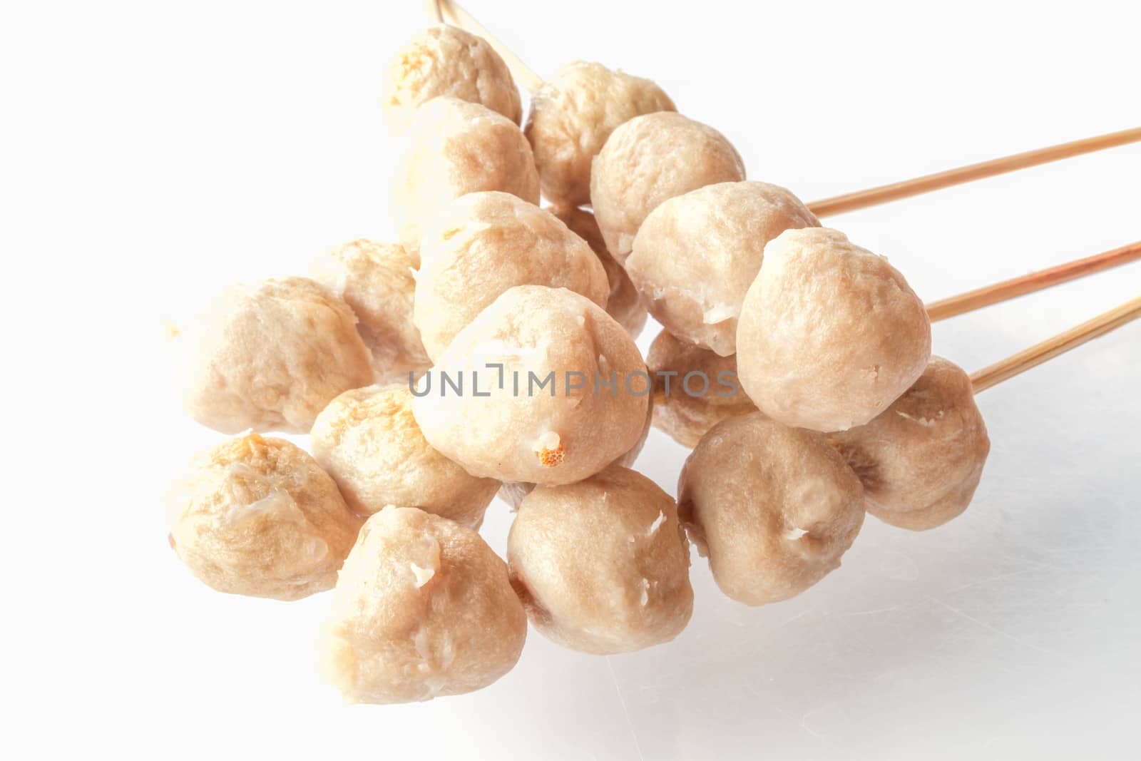 Mini pork balls in wood stick on clean table by punsayaporn