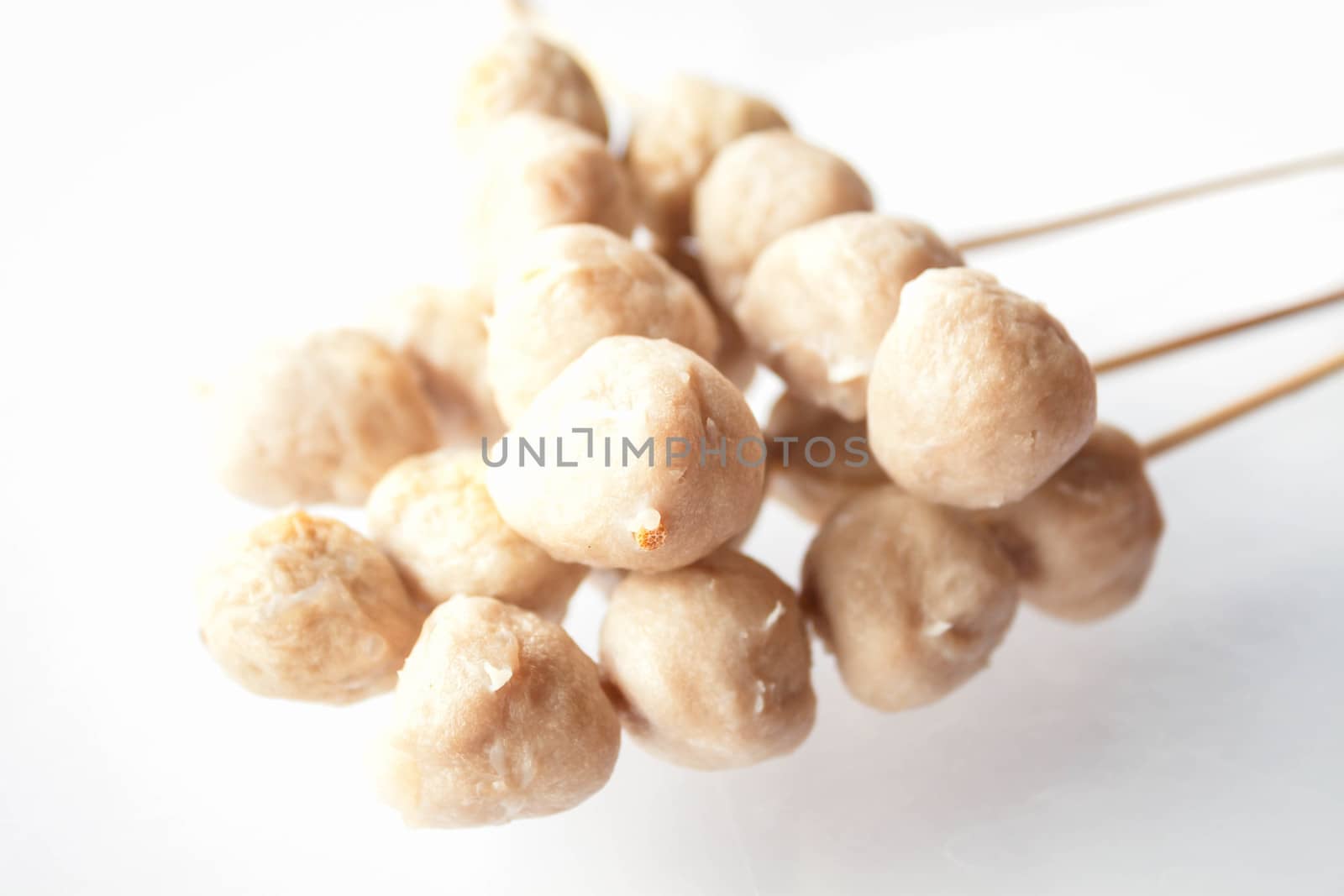 Mini pork balls in wood stick on clean table by punsayaporn