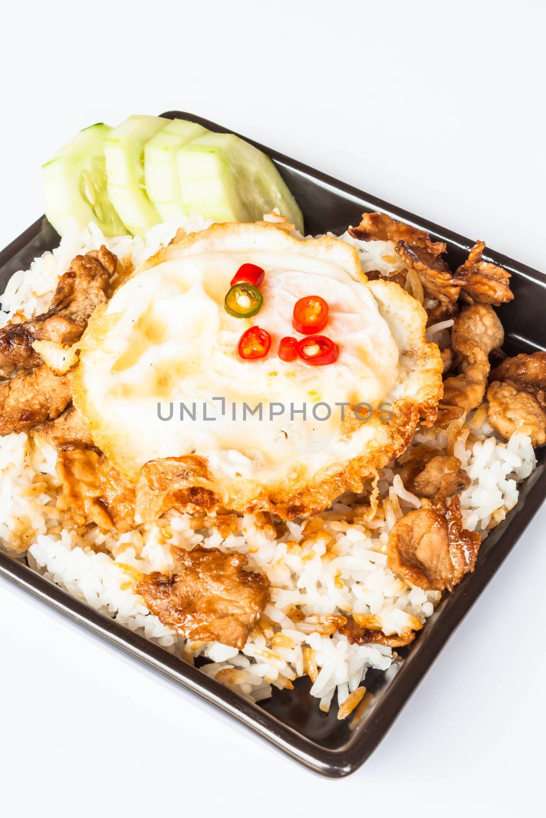 Egg fried and fried pork garlic with soy sauce topped on rice by punsayaporn