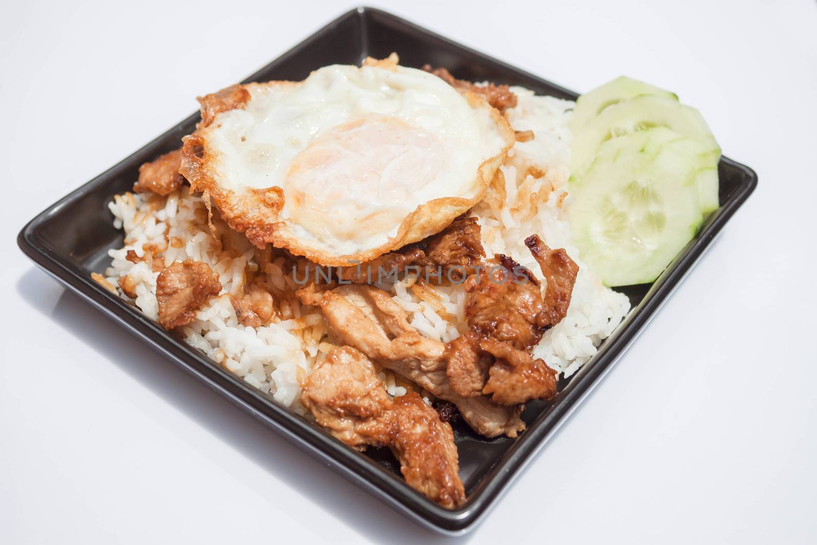 Egg fried and fried pork garlic with soy sauce topped on rice by punsayaporn