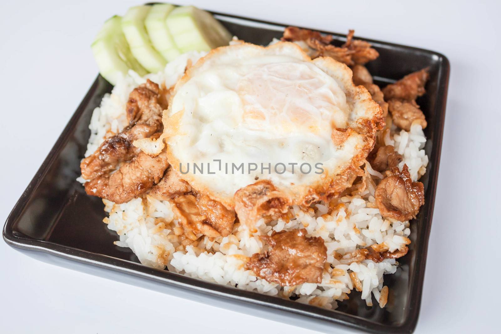 Egg fried and fried pork garlic with soy sauce topped on rice