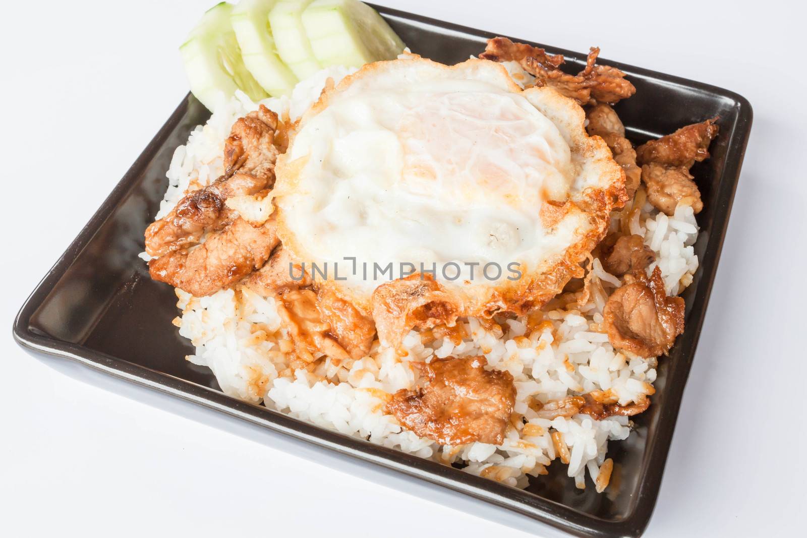 Egg fried and fried pork garlic with soy sauce topped on rice by punsayaporn