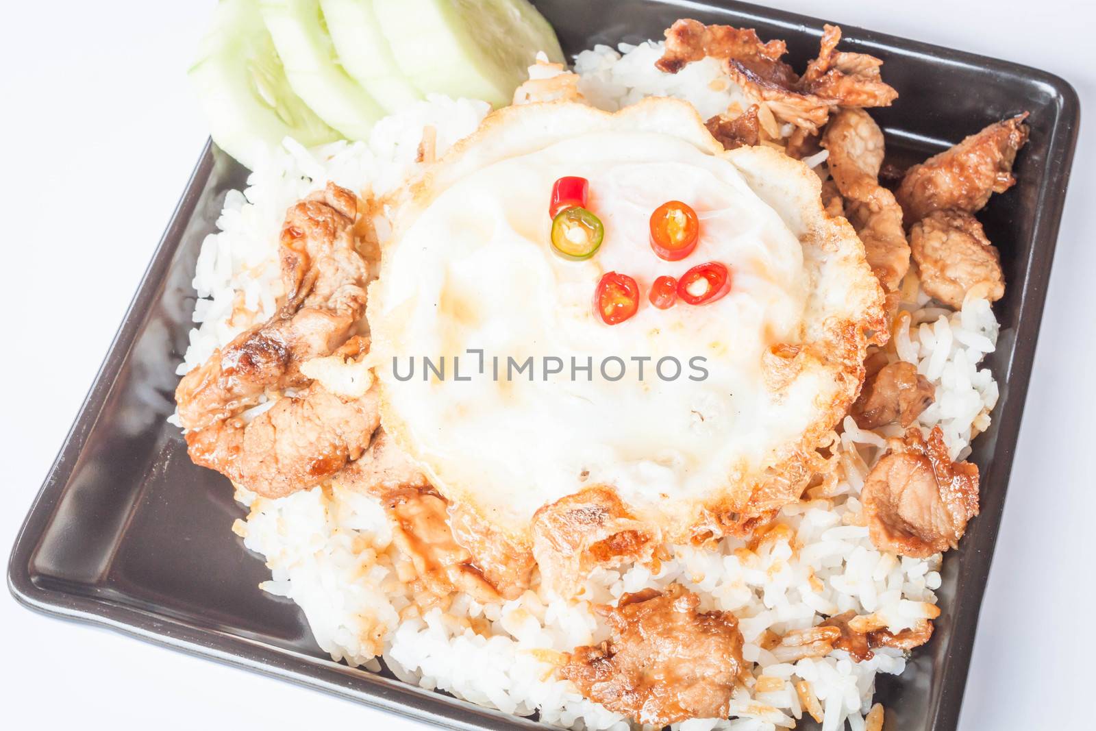 Egg fried and fried pork garlic with soy sauce topped on rice by punsayaporn