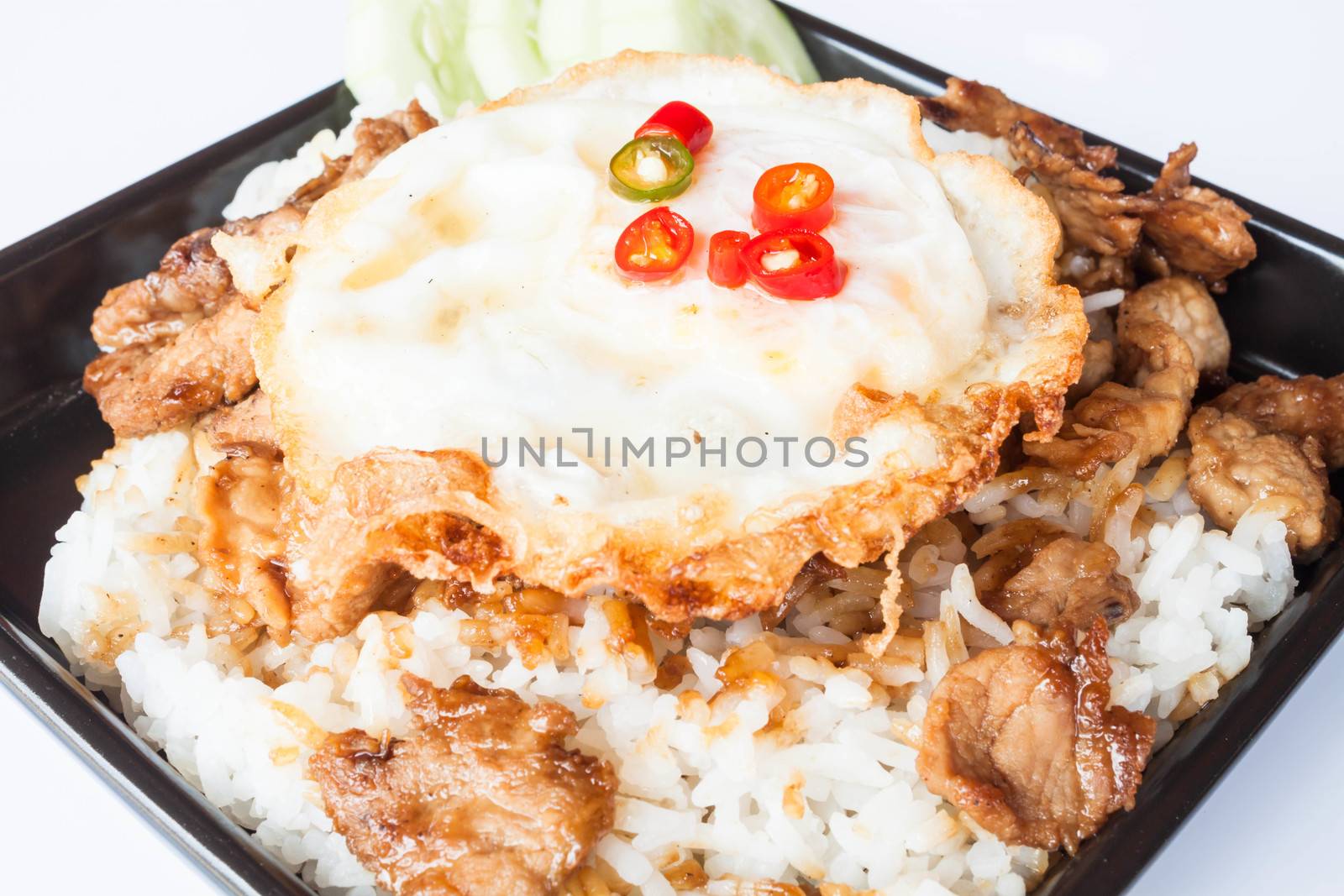 Egg fried and fried pork garlic with soy sauce topped on rice by punsayaporn