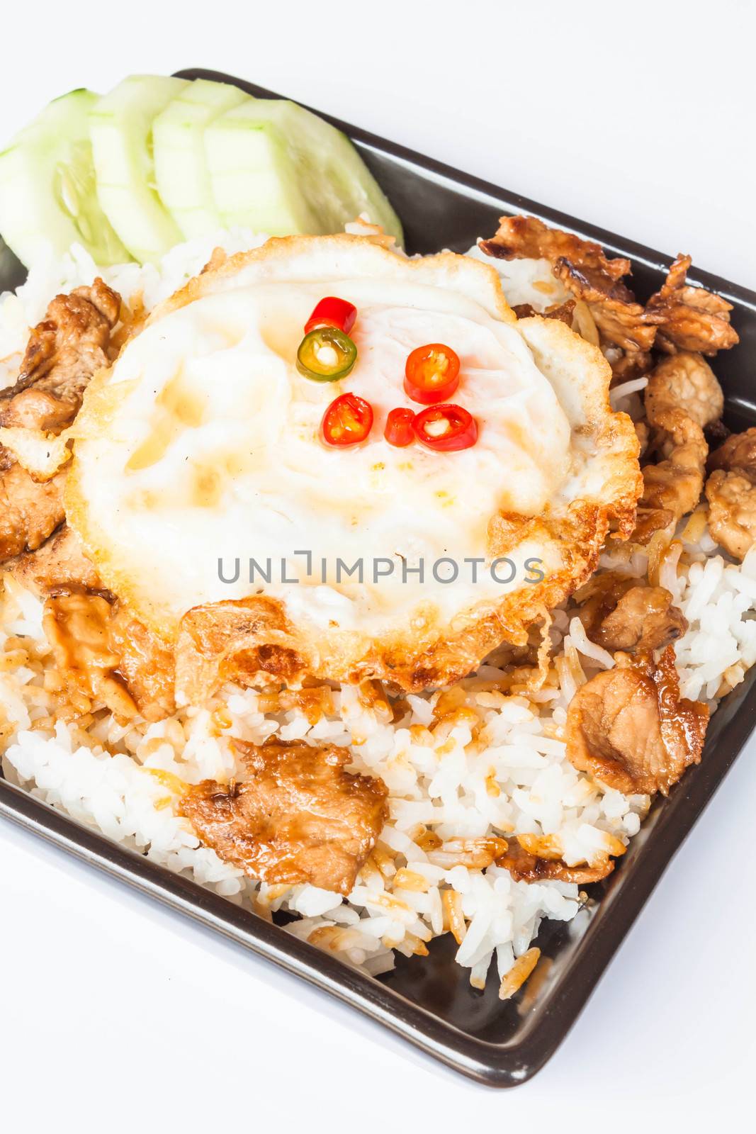 Egg fried and fried pork garlic with soy sauce topped on rice by punsayaporn