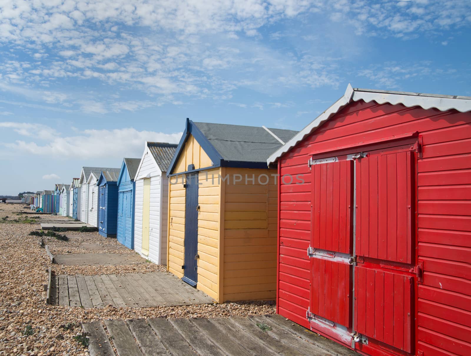 coloured beach huts on the south coast of England
