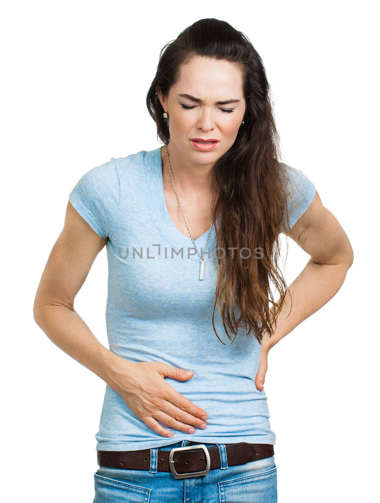 A woman suffering from a tummy pains or tummy bug. Isolated on white.