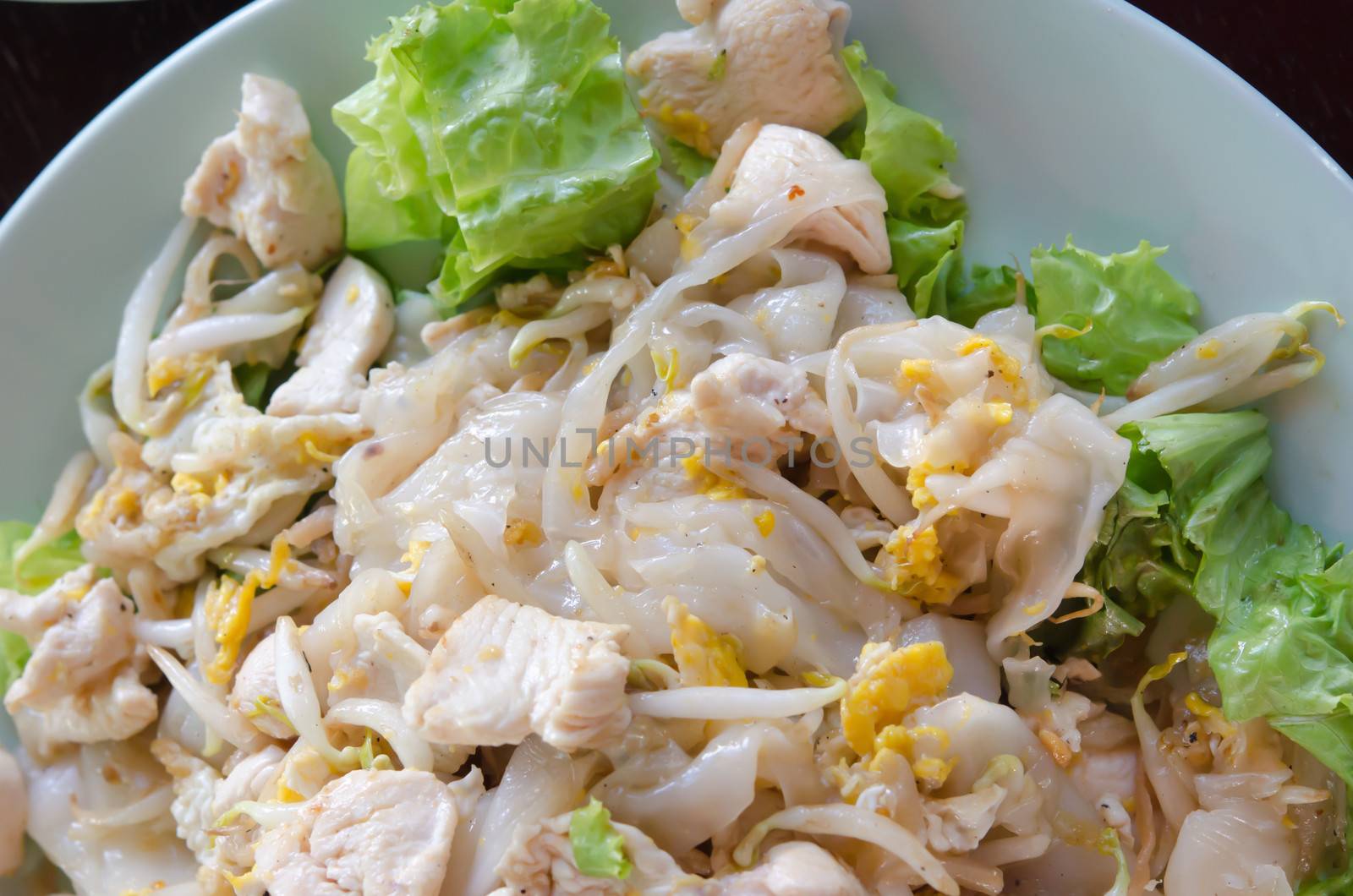 Top view Fried Noodles with chicken , egg and vegetable