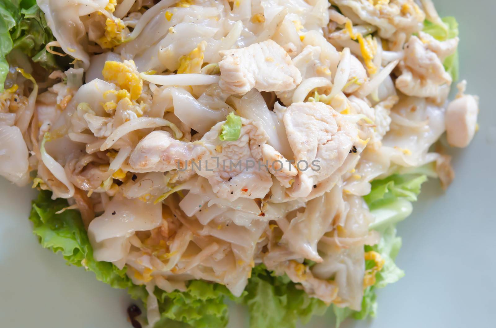 Top view Fried Noodles  with chicken , egg and vegetable on plate