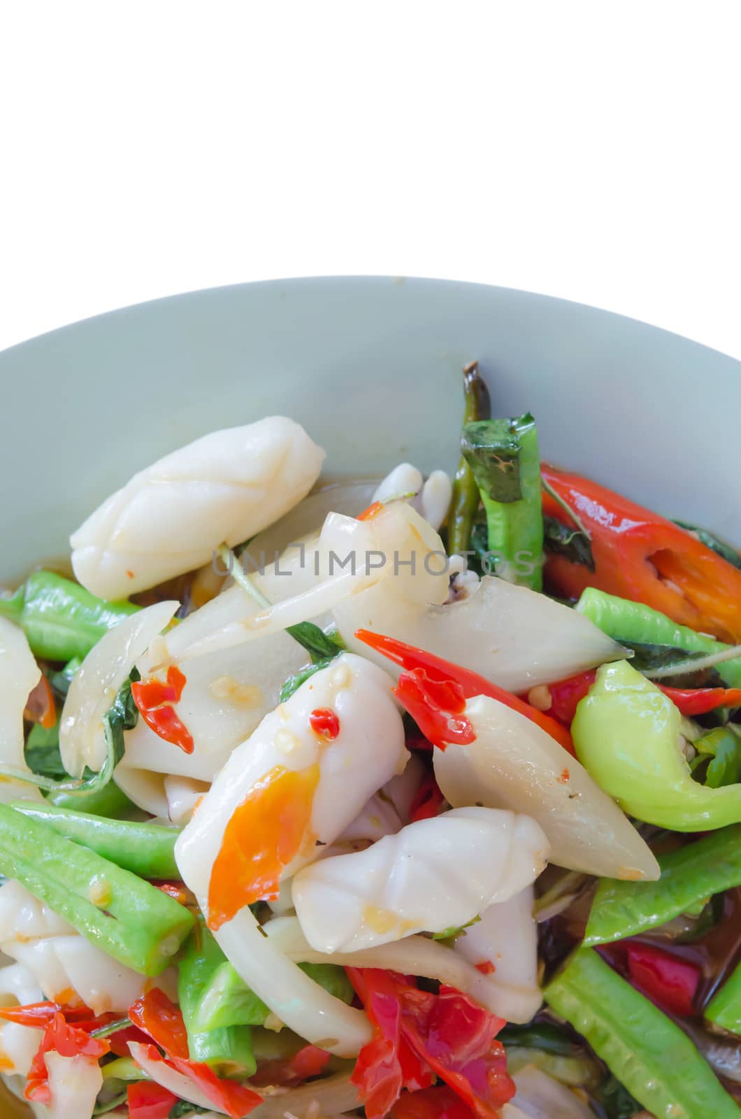 squid  fried with chili pepper ,  mix vegetable on dish over white background