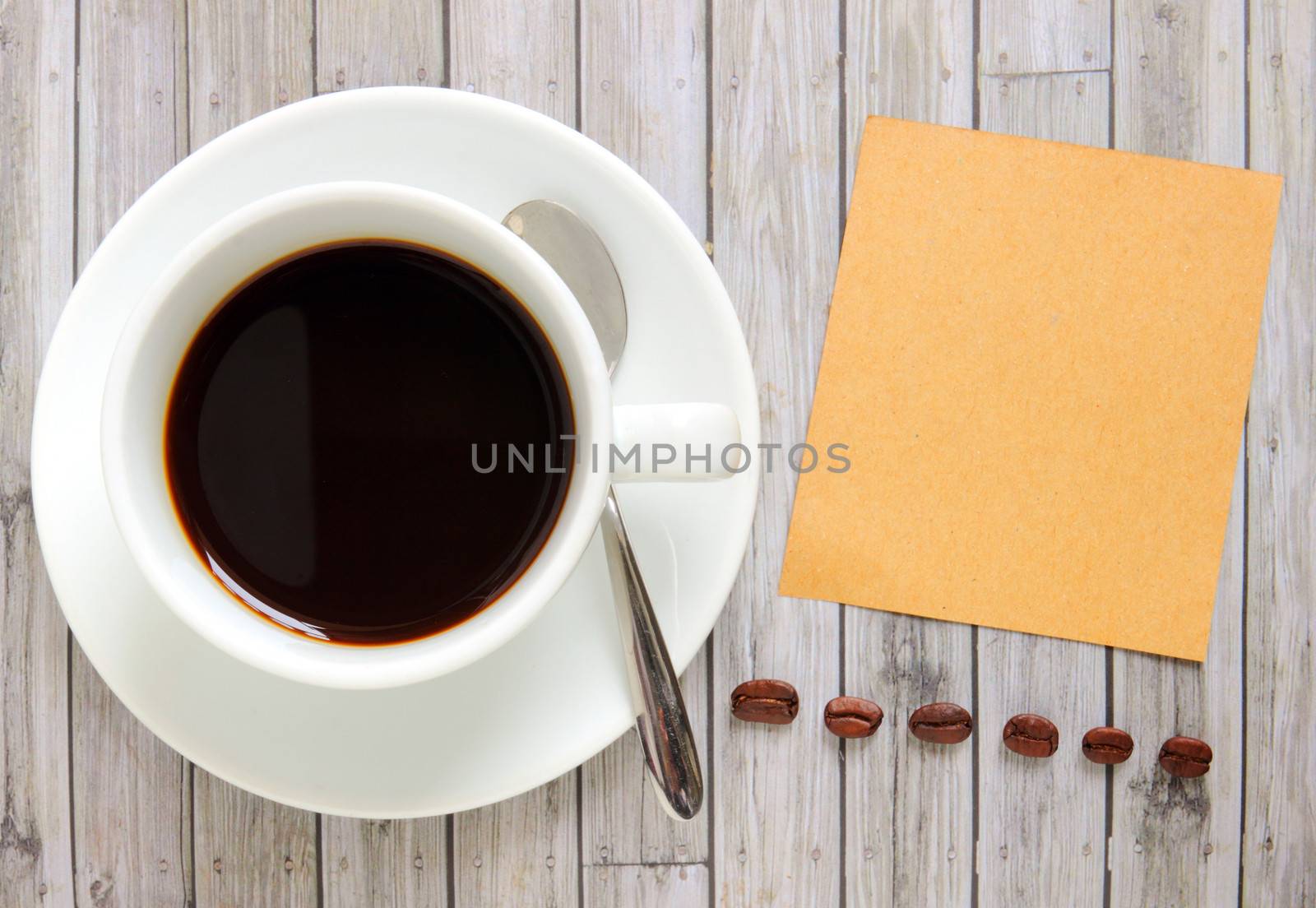 Blank paper with hot coffee cup and coffee beans by nuchylee