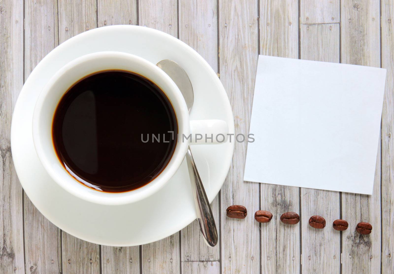 Blank paper with hot coffee cup and coffee beans by nuchylee