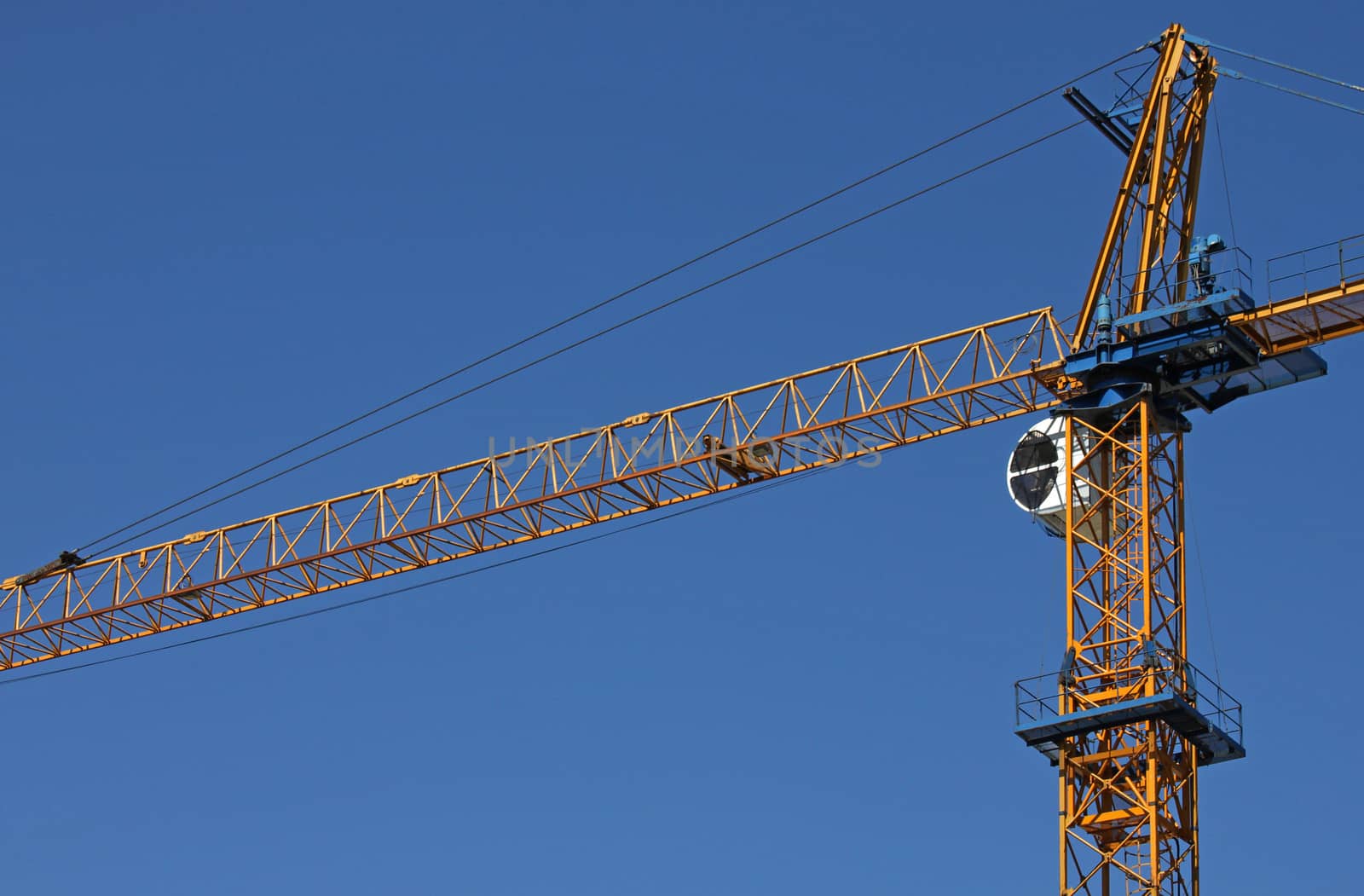 building crane over blue sky