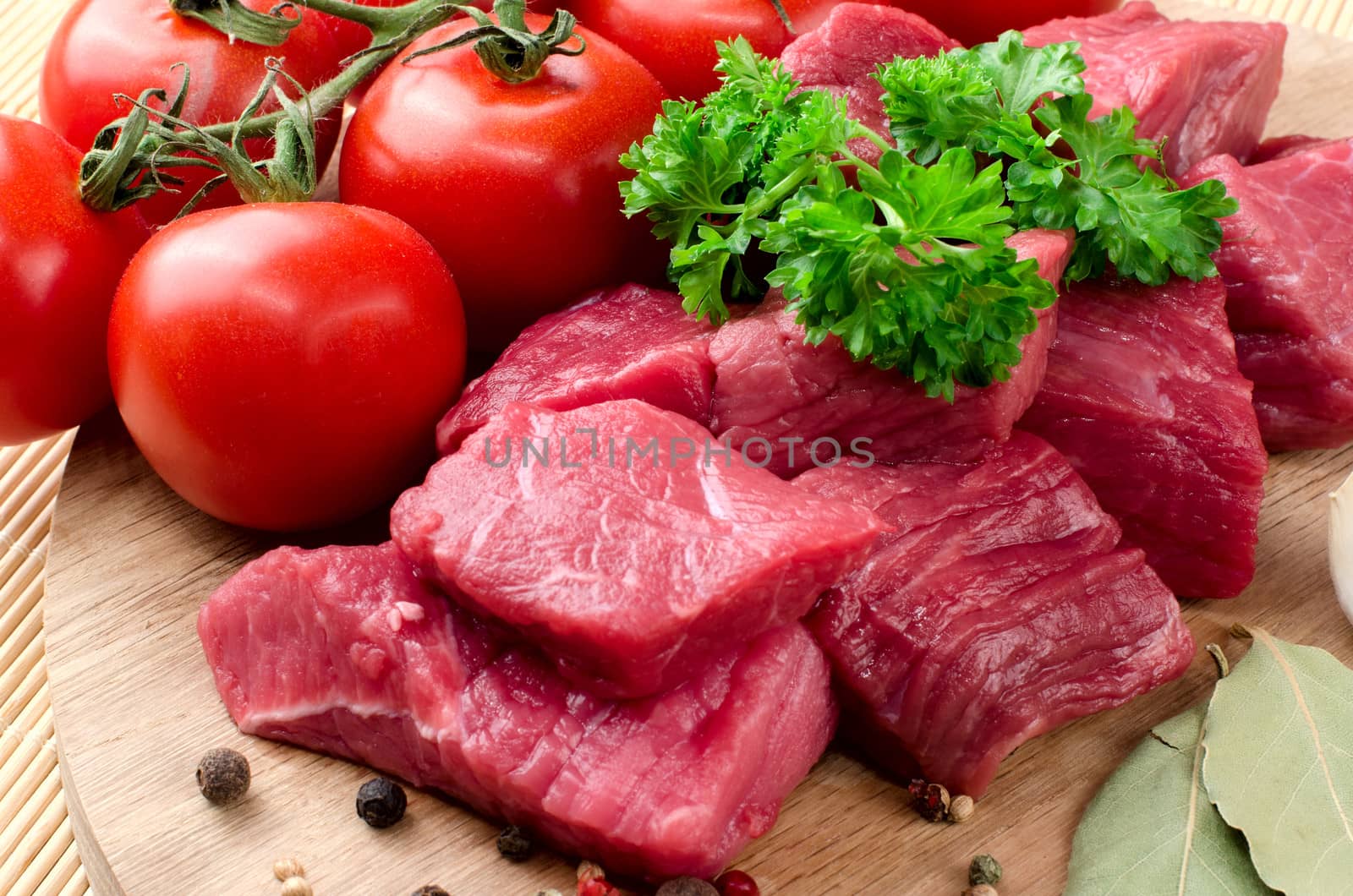Fresh raw meat on wooden board.