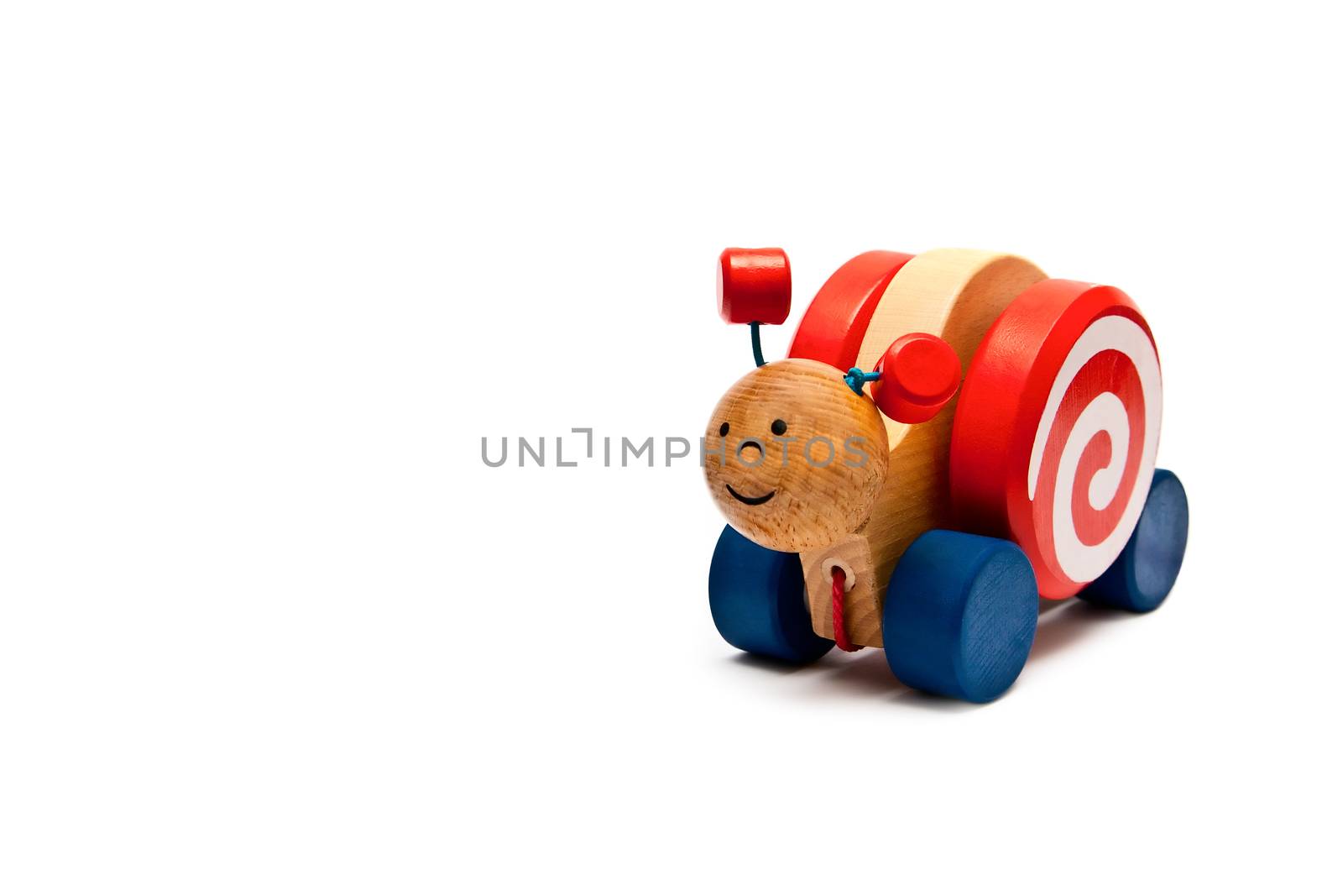 Children's toys - wooden snail on wheels with a rope