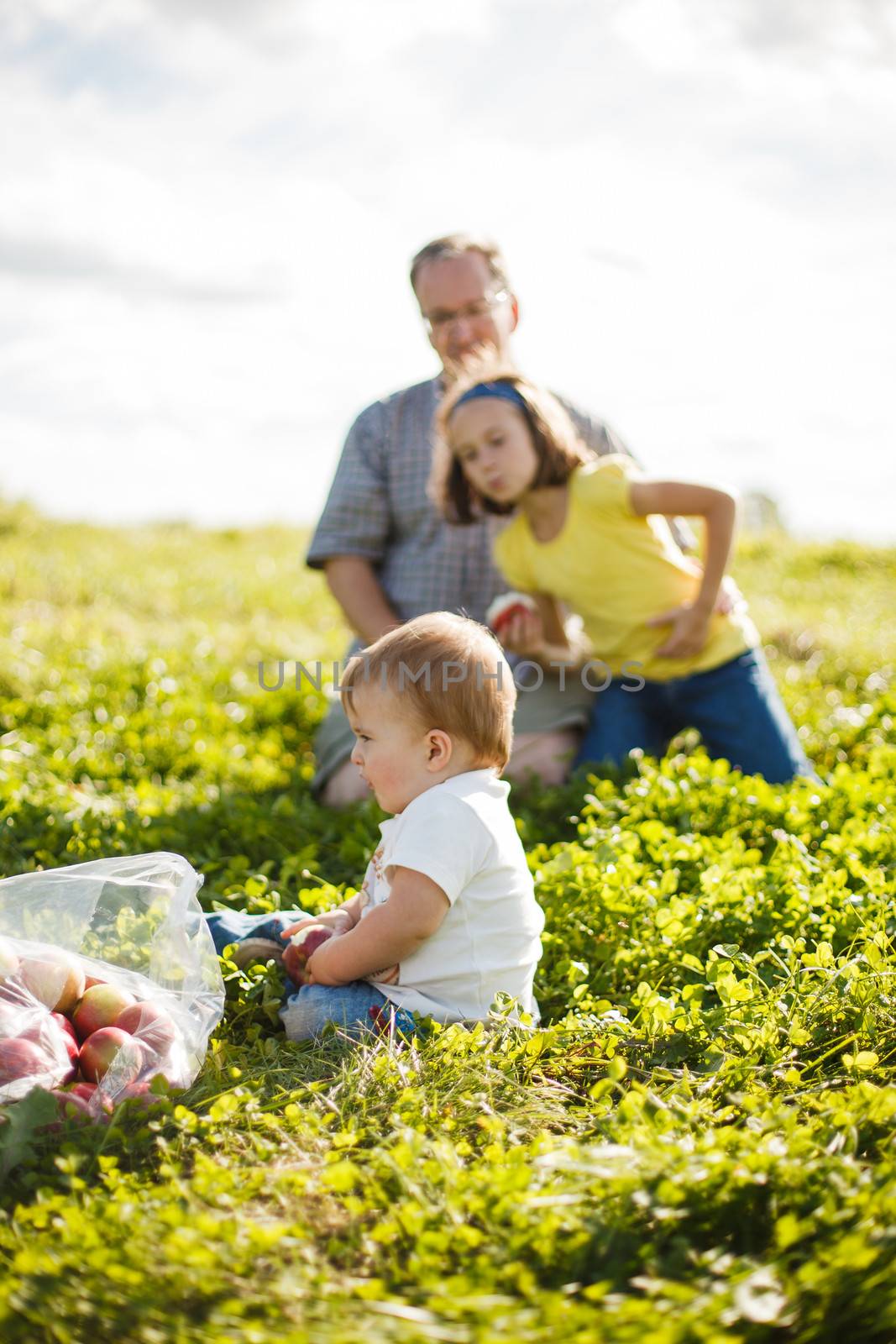family on the grass by Talanis